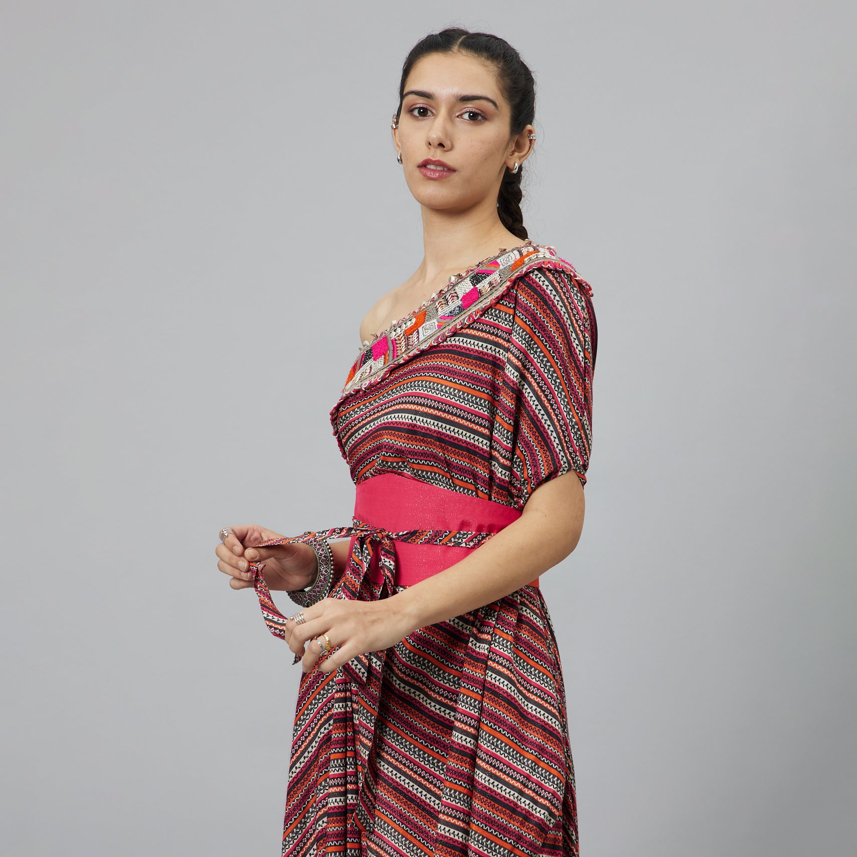 BOHEMIAN STRIPE ONE SHOULDER COWL DRESS TEAMED WITH A BELT