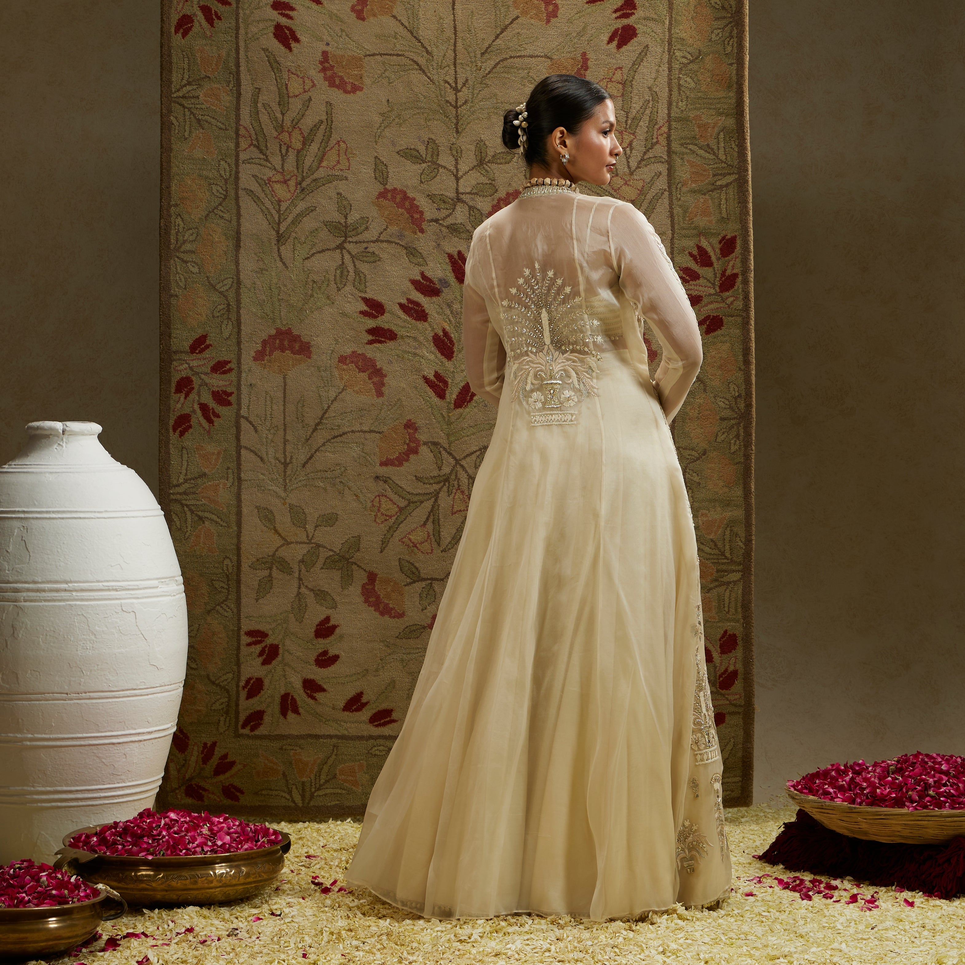 MEHEK: MAGNOLIA ORGANZA EMBELLISHED JACKET PAIRED WITH METAL BUSTIER AND LEHENGA