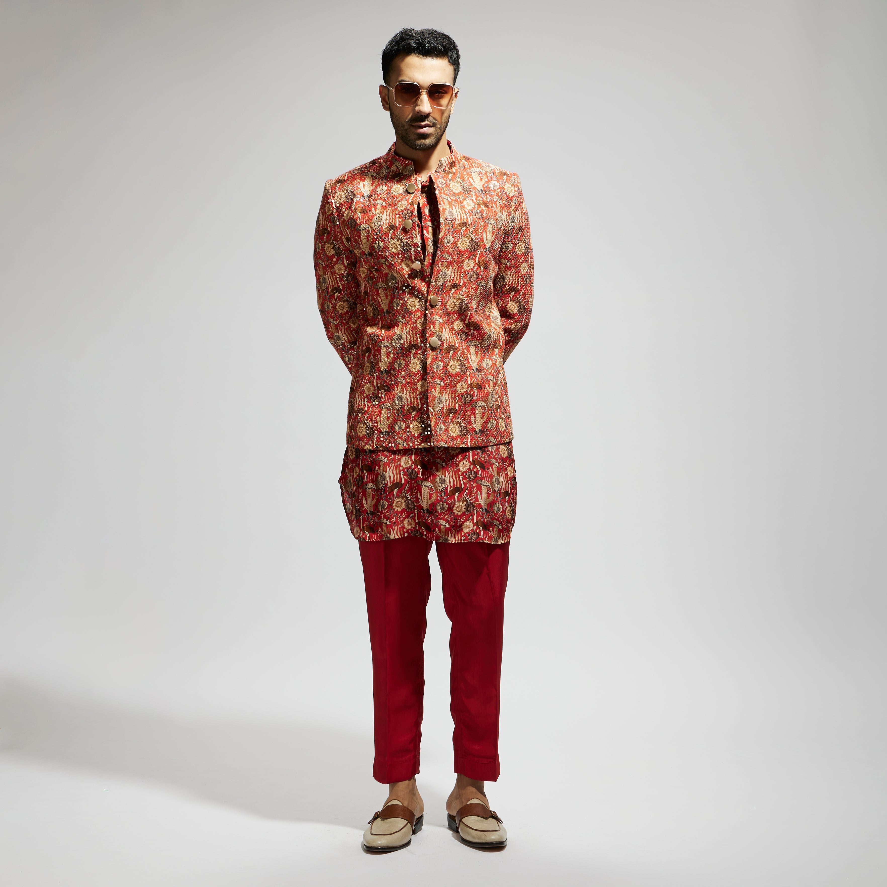 ORANGE JAAL EMBELLISHED BANDHGALA PAIRED WITH JAAL KURTA AND PANTS