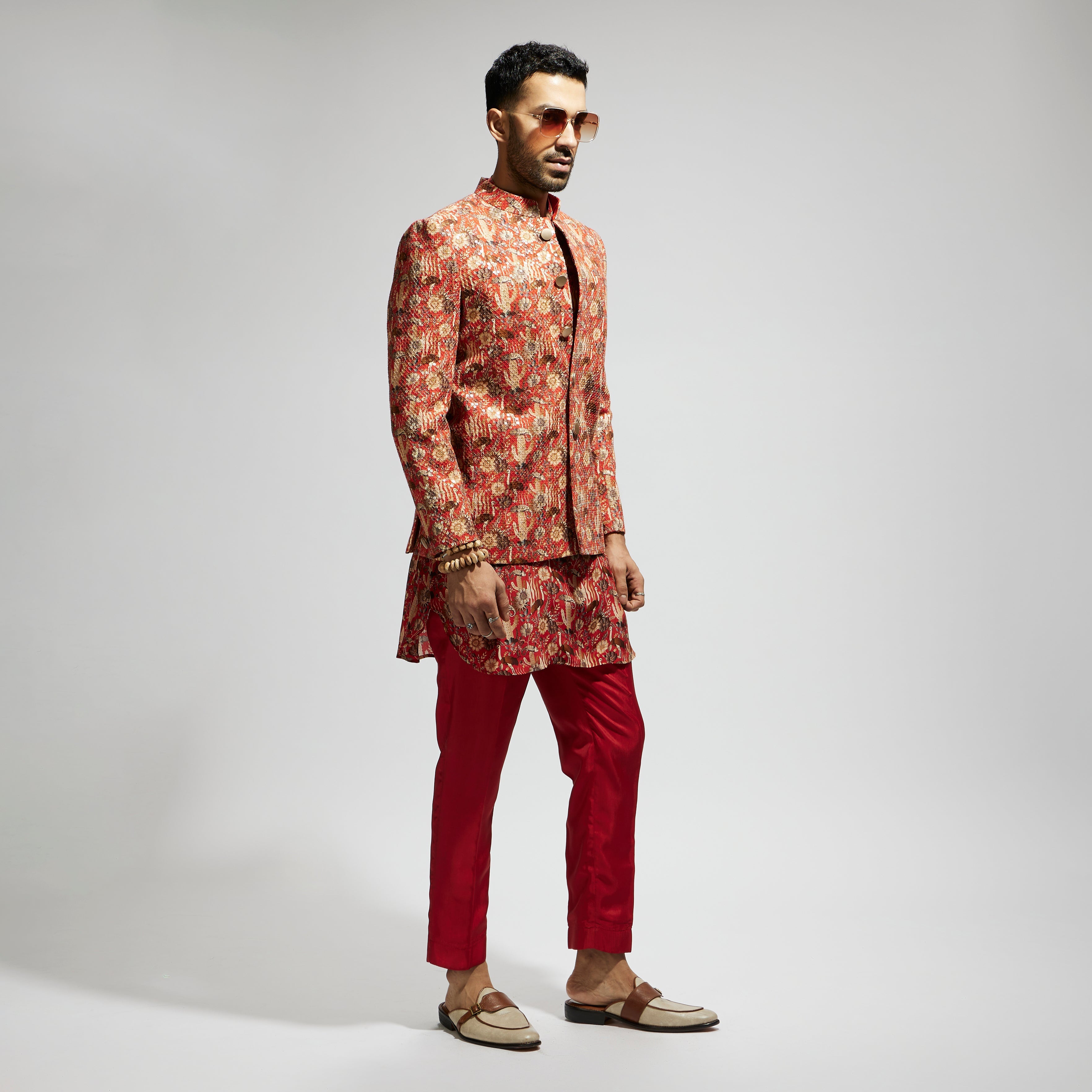 ORANGE JAAL EMBELLISHED BUNDI PAIRED WITH ORANGE DRAPE KURTA AND PANTS