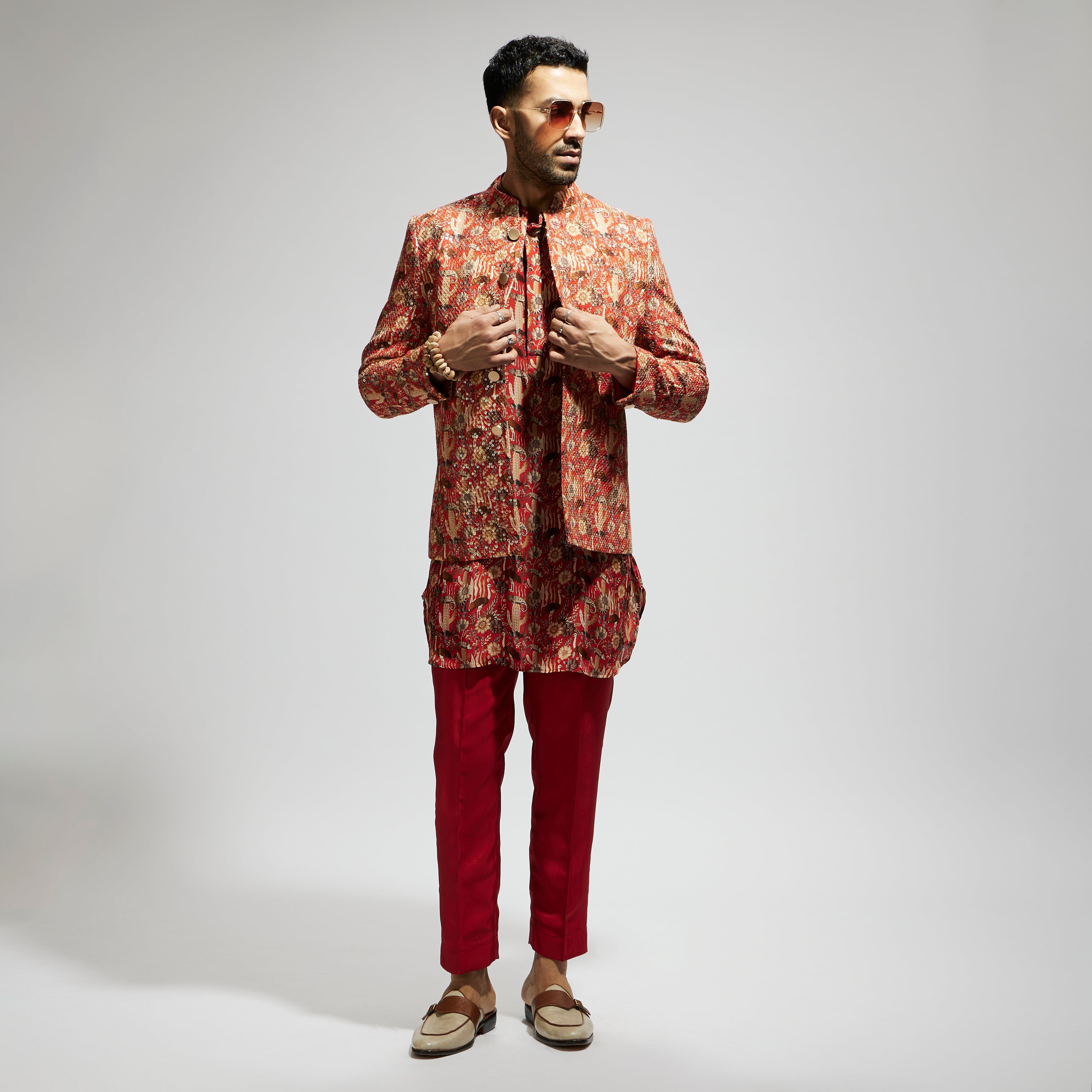 ORANGE JAAL EMBELLISHED BUNDI PAIRED WITH ORANGE DRAPE KURTA AND PANTS