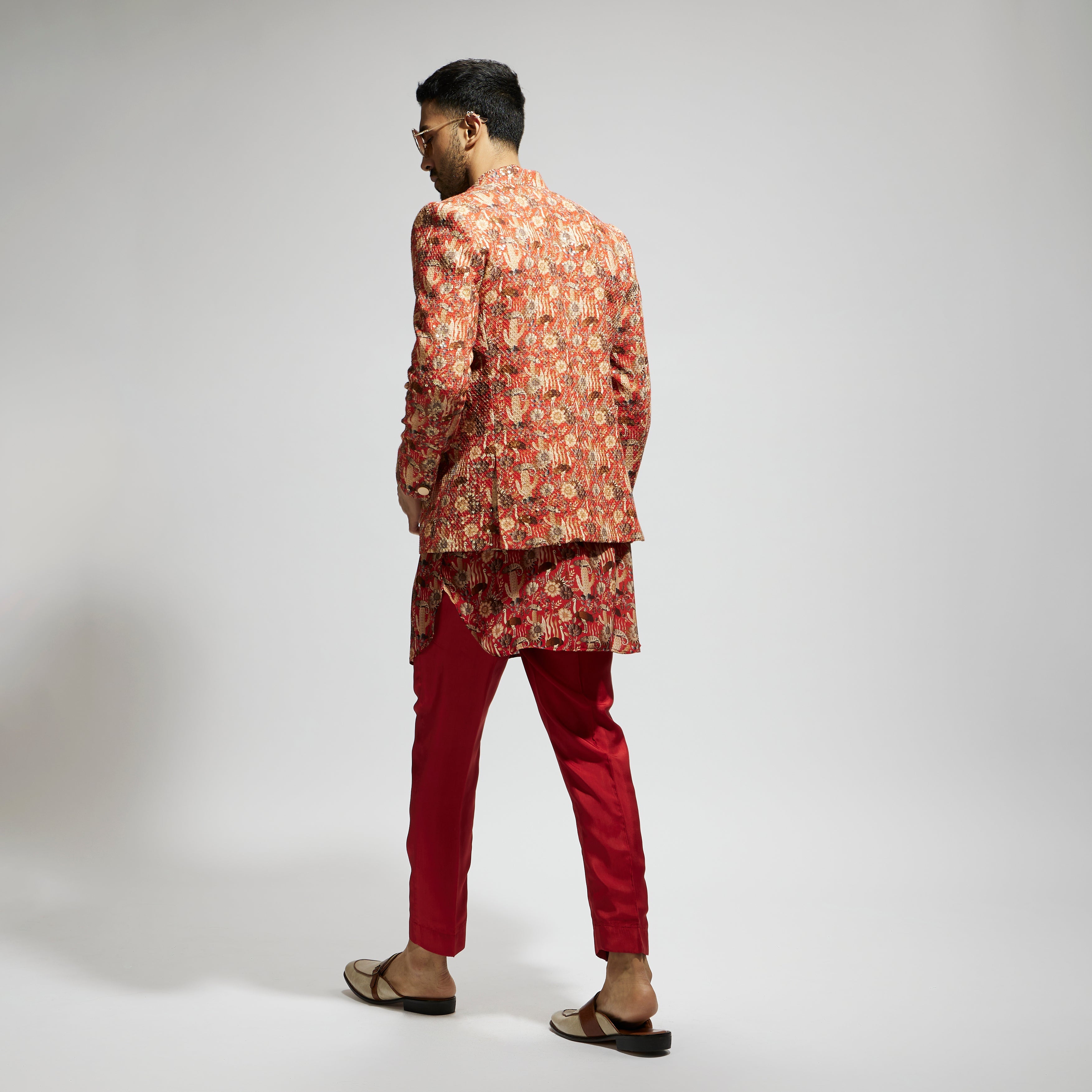 ORANGE JAAL EMBELLISHED BANDHGALA PAIRED WITH JAAL KURTA AND PANTS