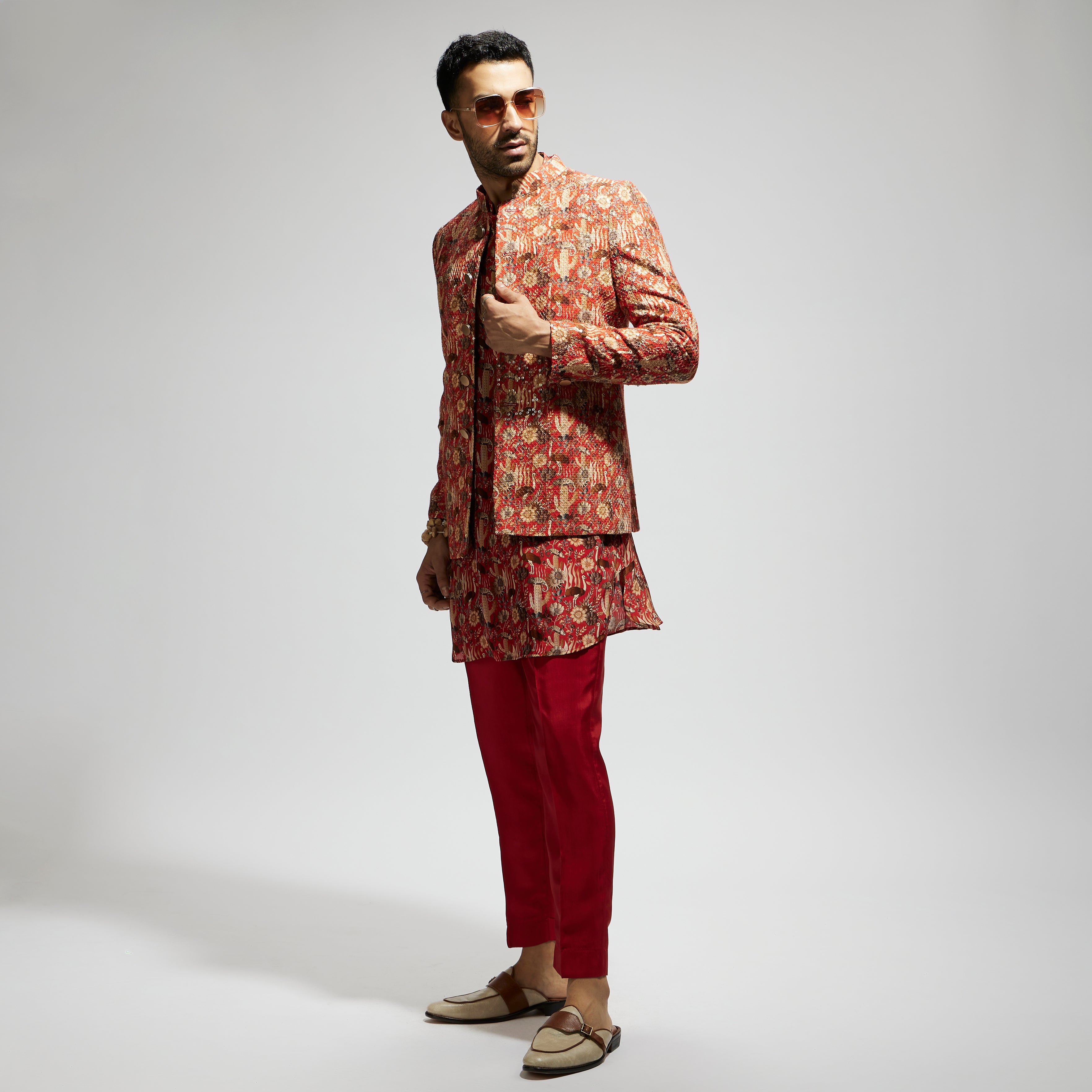 ORANGE JAAL EMBELLISHED BUNDI PAIRED WITH ORANGE DRAPE KURTA AND PANTS