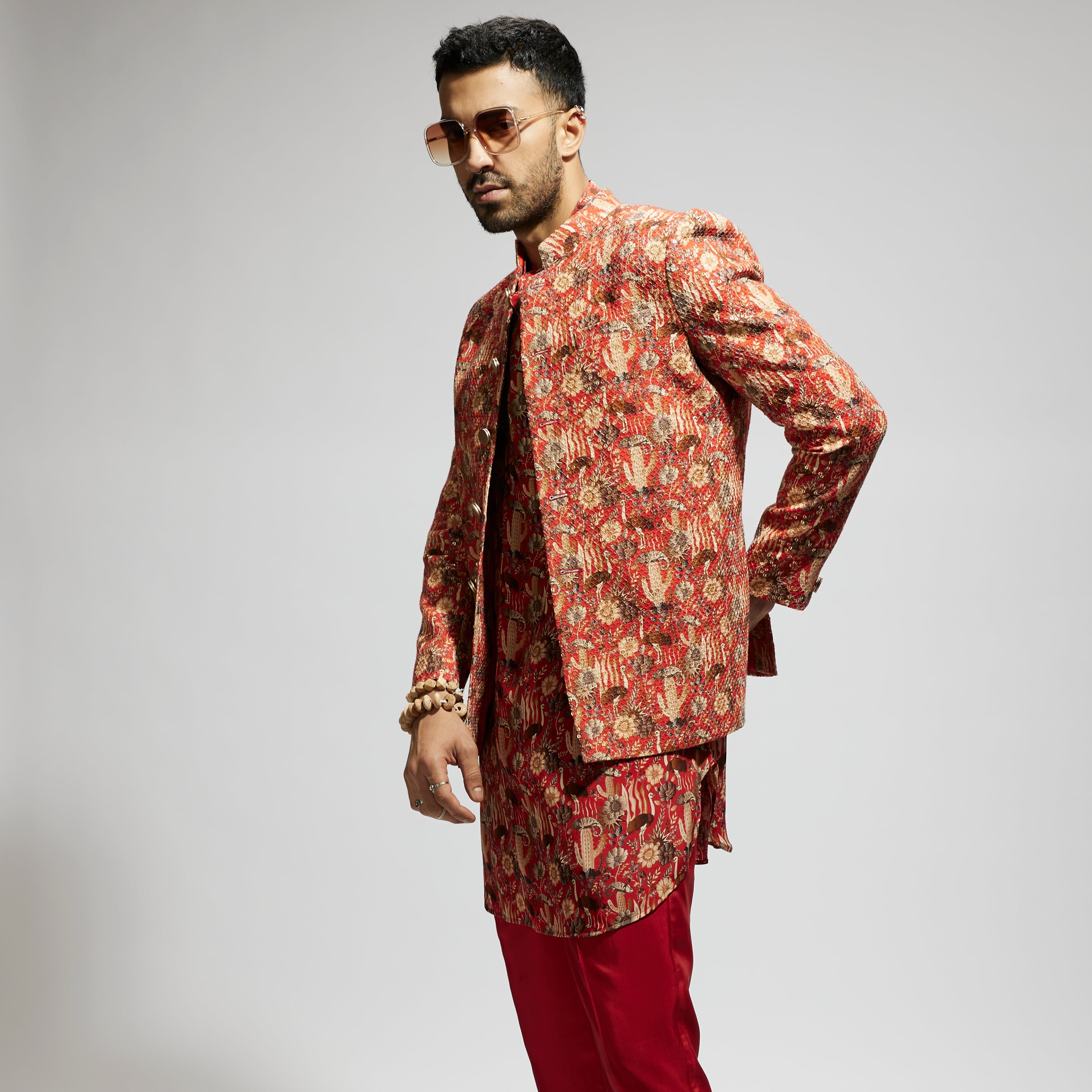 ORANGE JAAL EMBELLISHED BANDHGALA PAIRED WITH JAAL KURTA AND PANTS