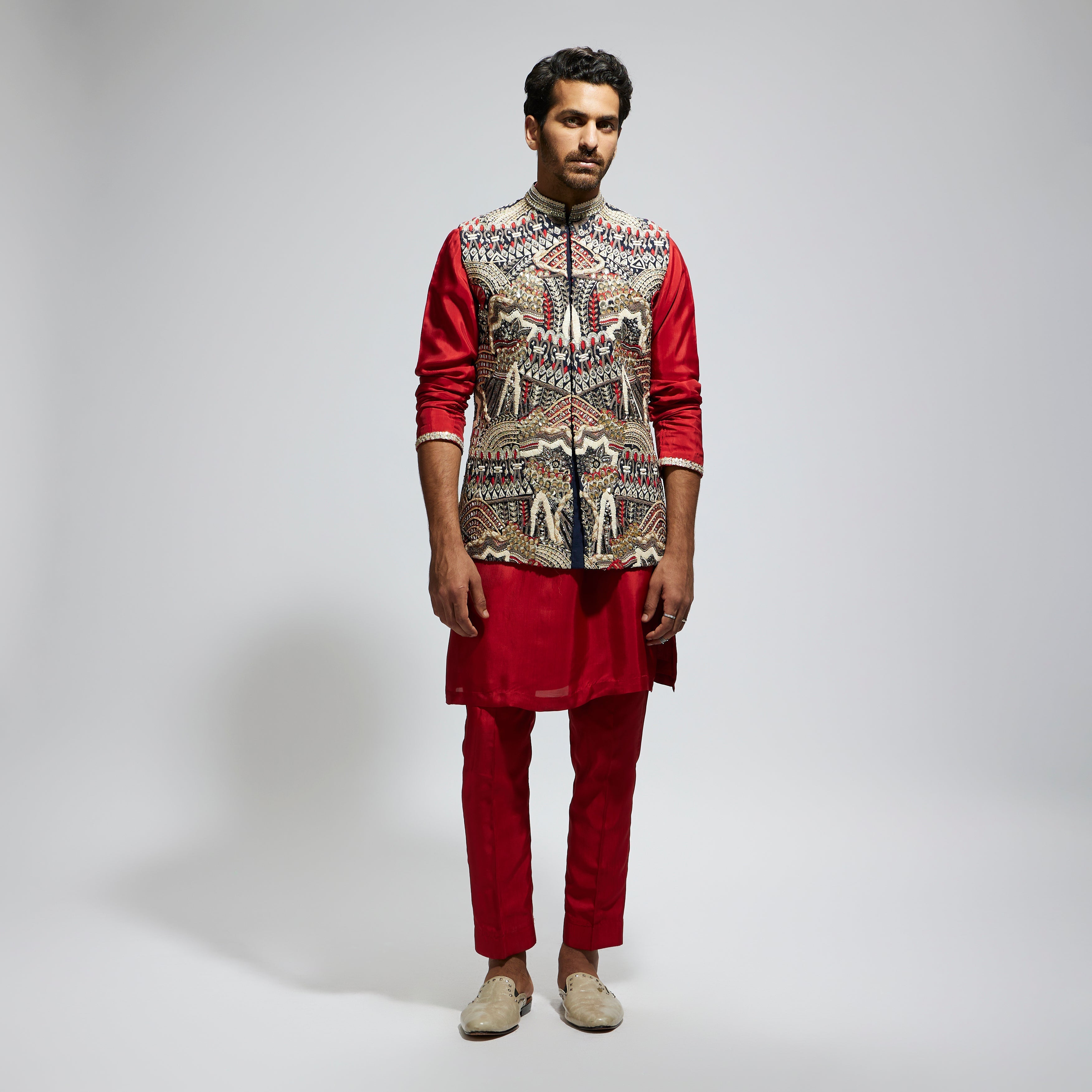 SAMSARA: BLUE ABTRACT EMBROIDERED BUNDI WITH ORANGE SOLID KURTA AND PANT