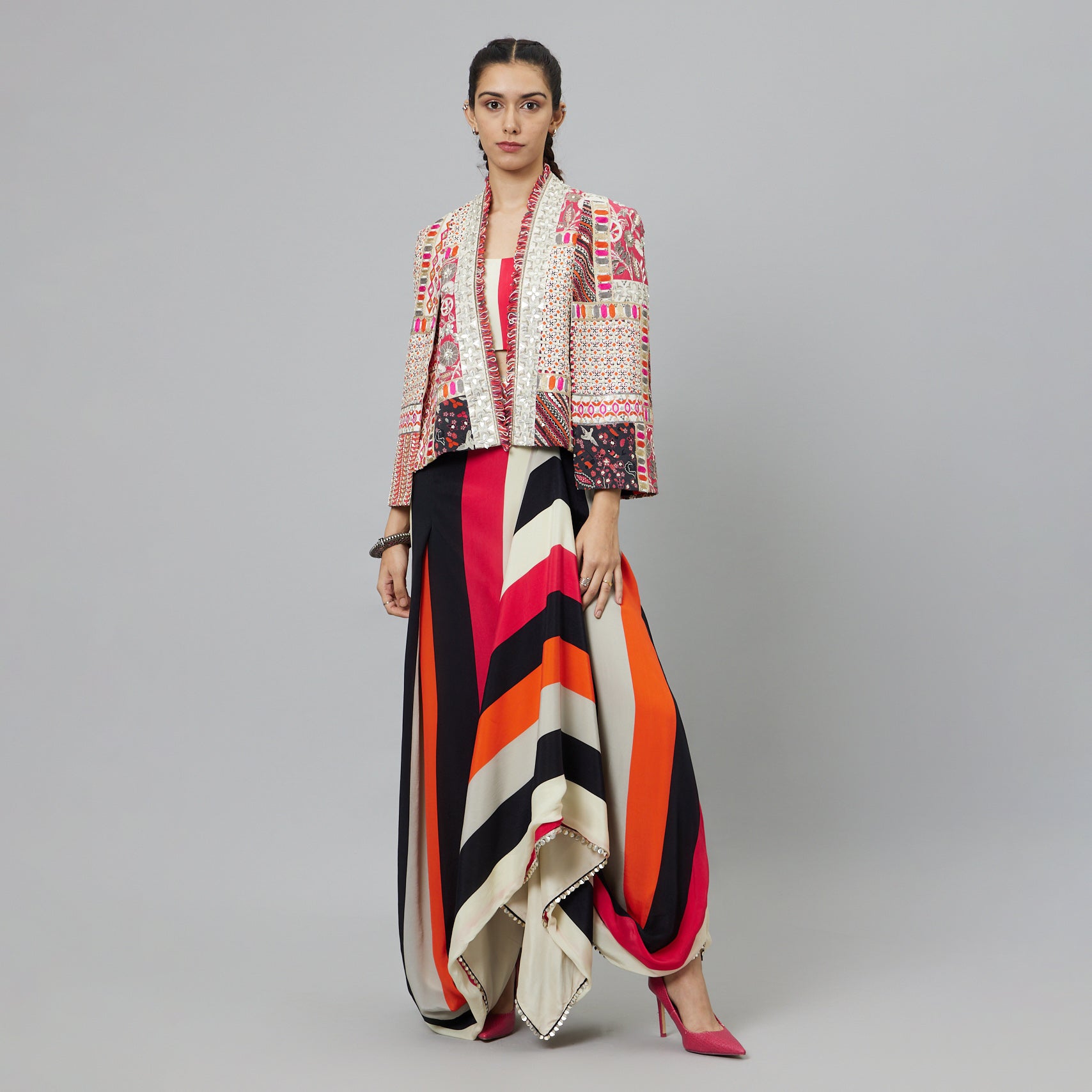 SHAHAR STRIPE PRINT NUSHRAT DRAPED SKIRT AND BUSTIER TEAMED WITH A SIGNATURE STRUCTURED JACKET