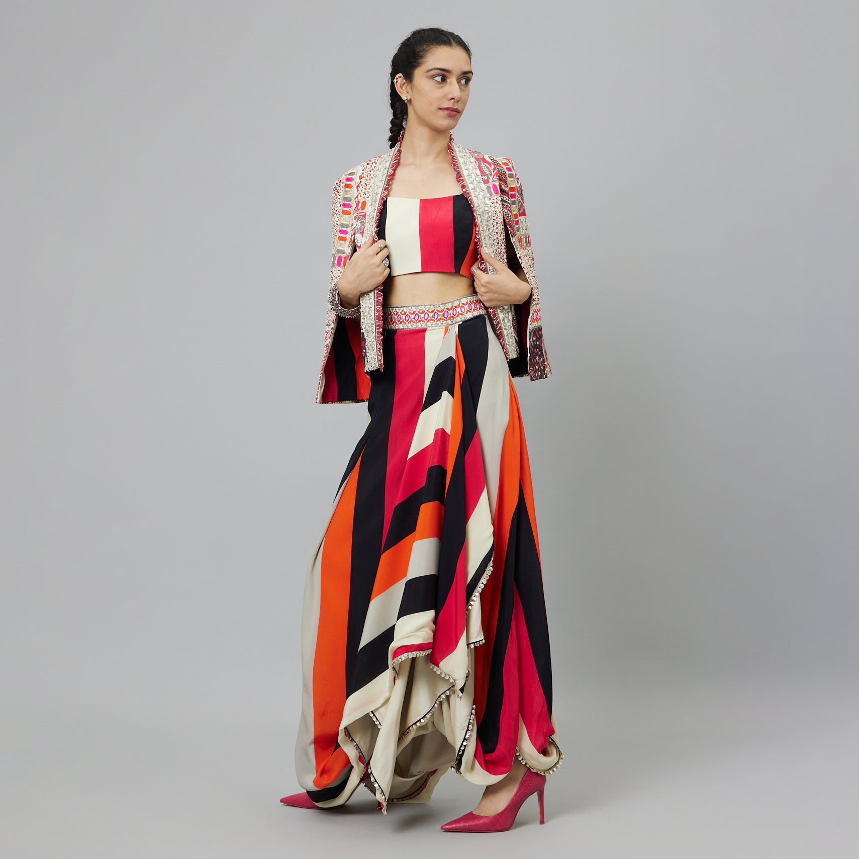 SHAHAR STRIPE PRINT NUSHRAT DRAPED SKIRT AND BUSTIER TEAMED WITH A SIGNATURE STRUCTURED JACKET