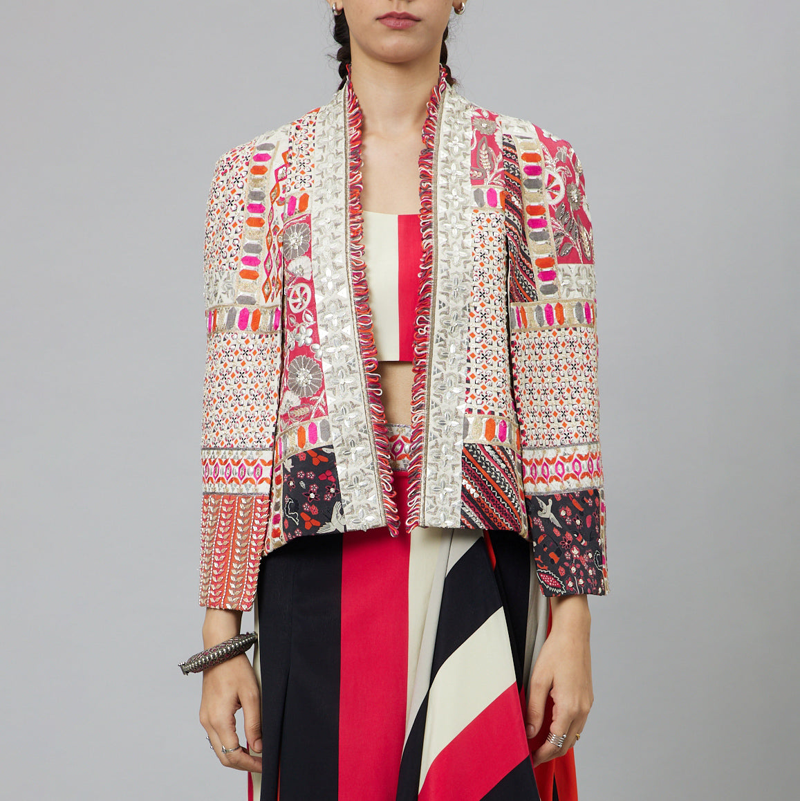 SHAHAR STRIPE PRINT NUSHRAT DRAPED SKIRT AND BUSTIER TEAMED WITH A SIGNATURE STRUCTURED JACKET