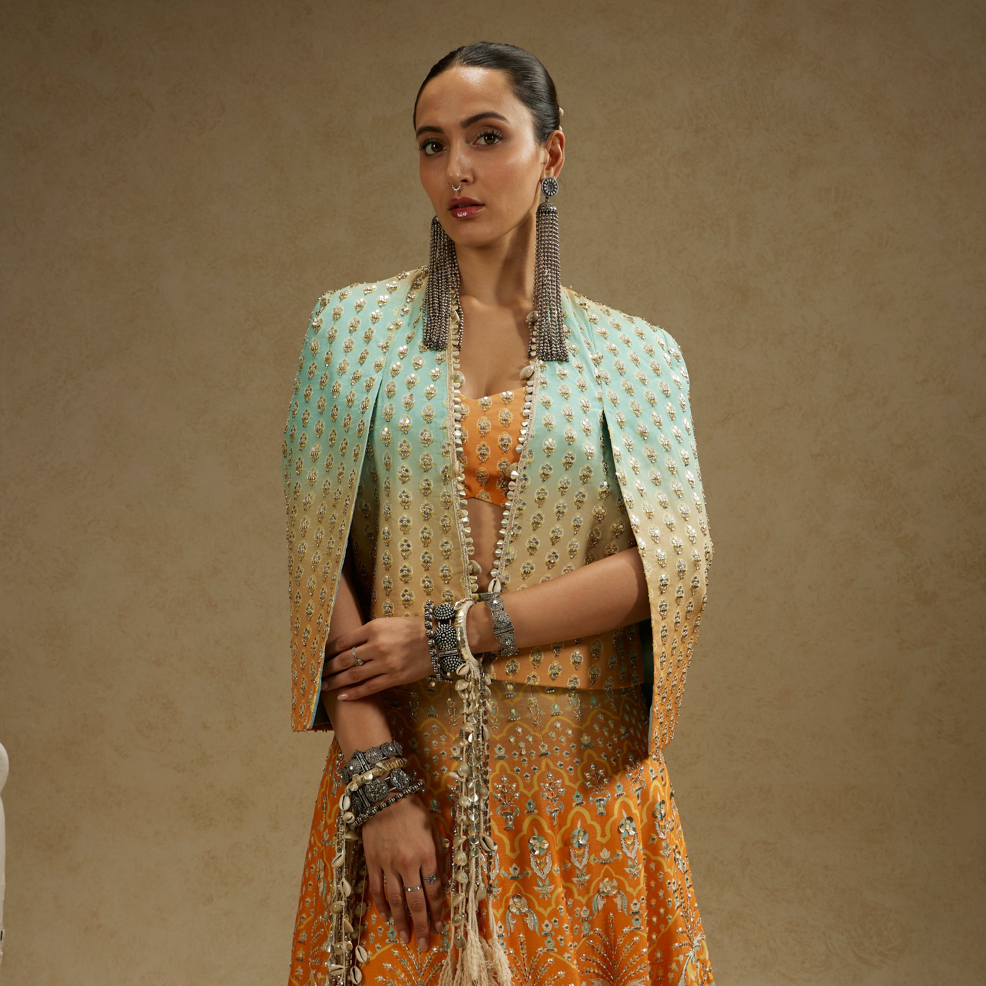 ORANGE BLUE EMBELLISHED NOOR JACKET PAIRED WITH EMBELLISHED BUSTIER AND OMBRE EMBELLISHED LEHENGA