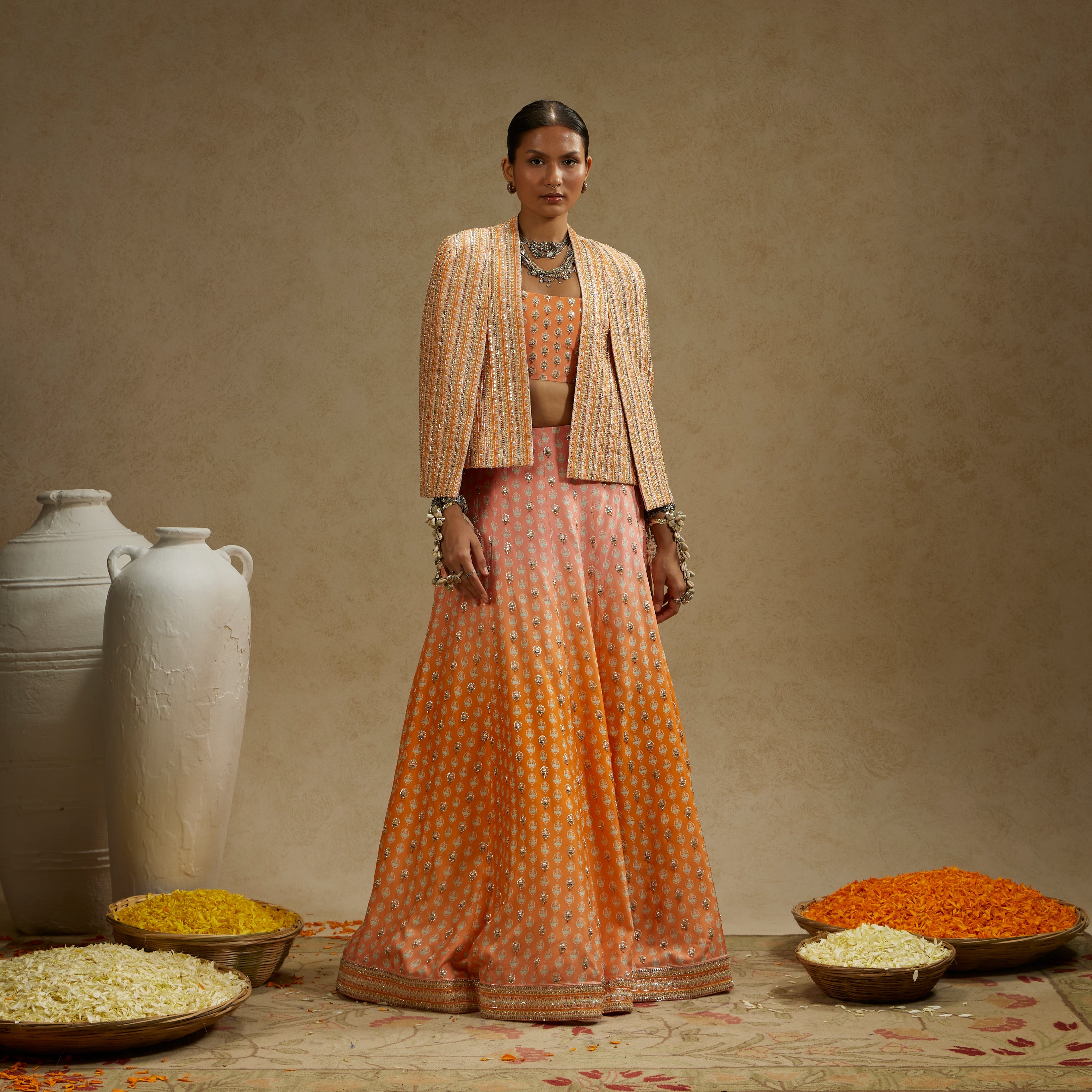 MEHEK: Border Embellished Noor Jacket Paired With Embellished Bustier And Ombre Embellished Lehenga