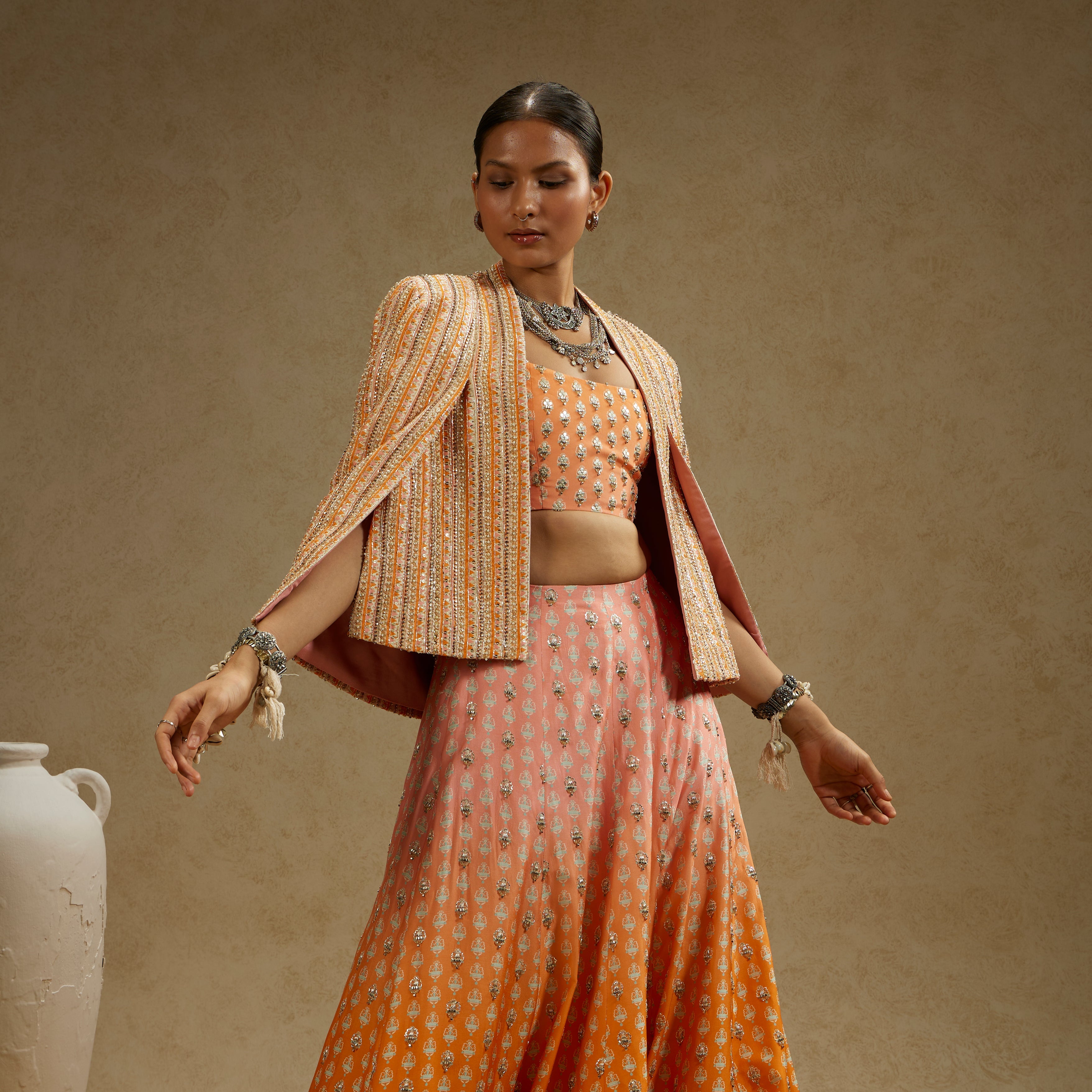 MEHEK: Border Embellished Noor Jacket Paired With Embellished Bustier And Ombre Embellished Lehenga