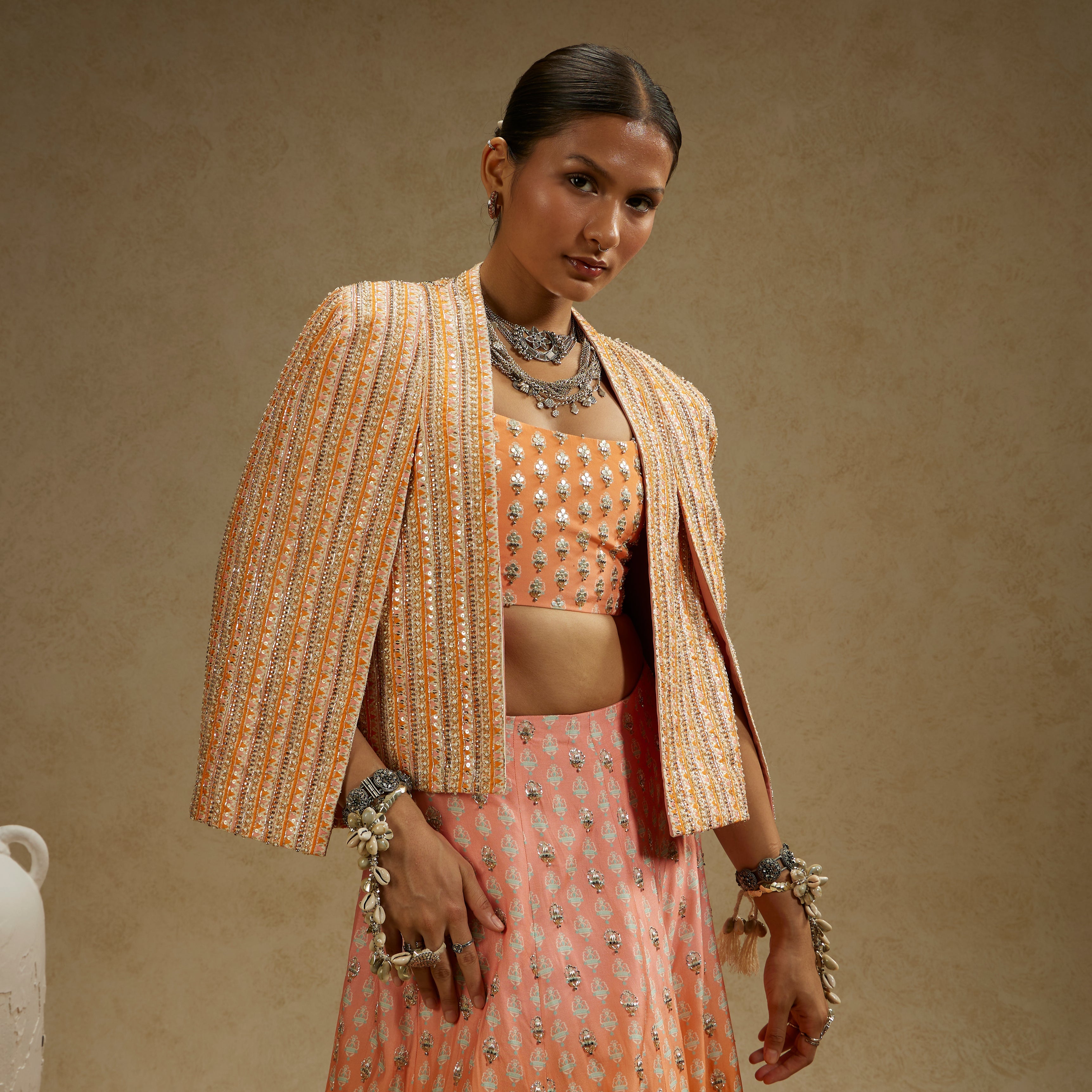 MEHEK: Border Embellished Noor Jacket Paired With Embellished Bustier And Ombre Embellished Lehenga