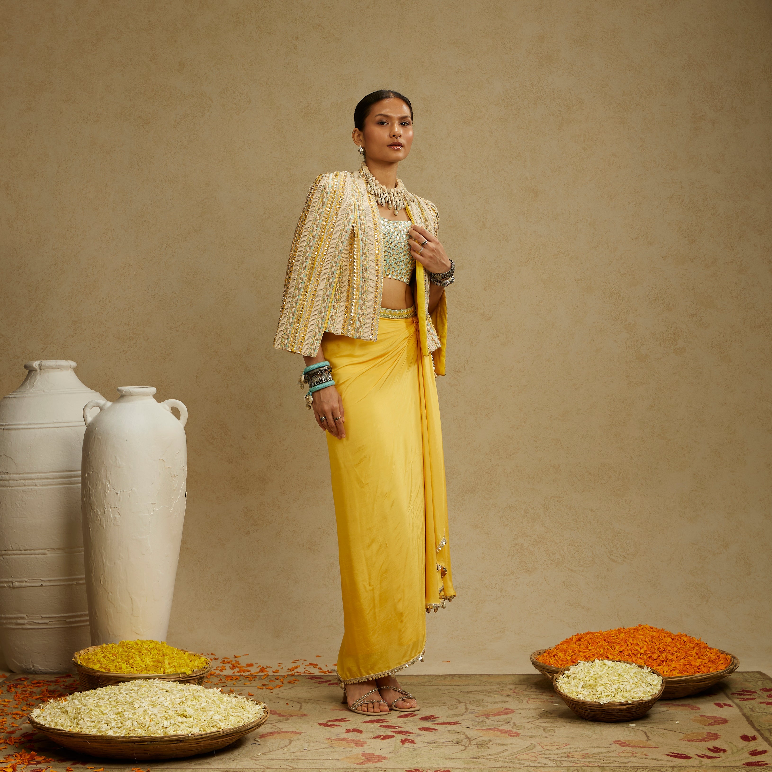 DANDELION EMBELLISHED JACKET PAIRED WITH EMBELLISHED BUSTIER AND HIGH SLIT SKIRT