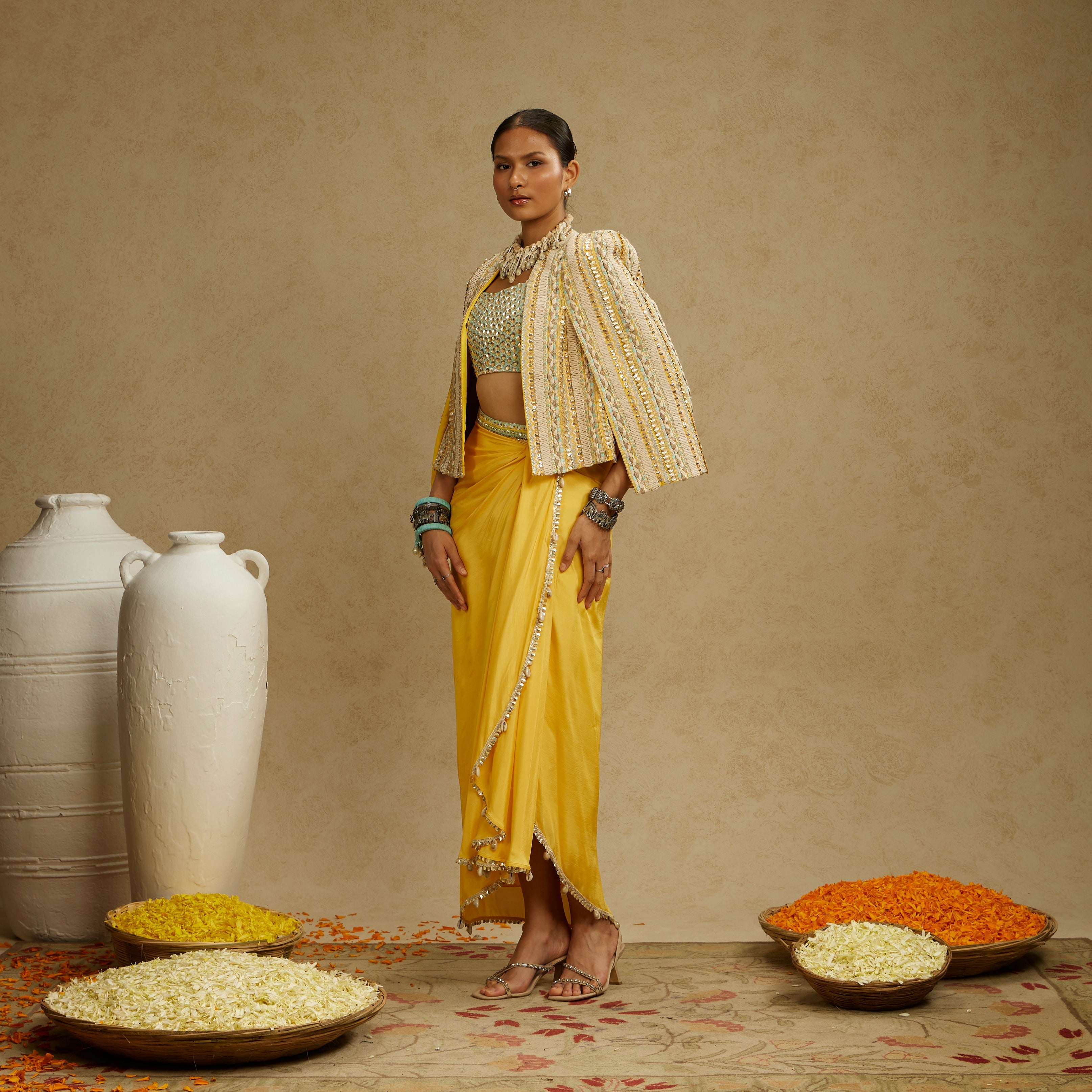 DANDELION EMBELLISHED JACKET PAIRED WITH EMBELLISHED BUSTIER AND HIGH SLIT SKIRT