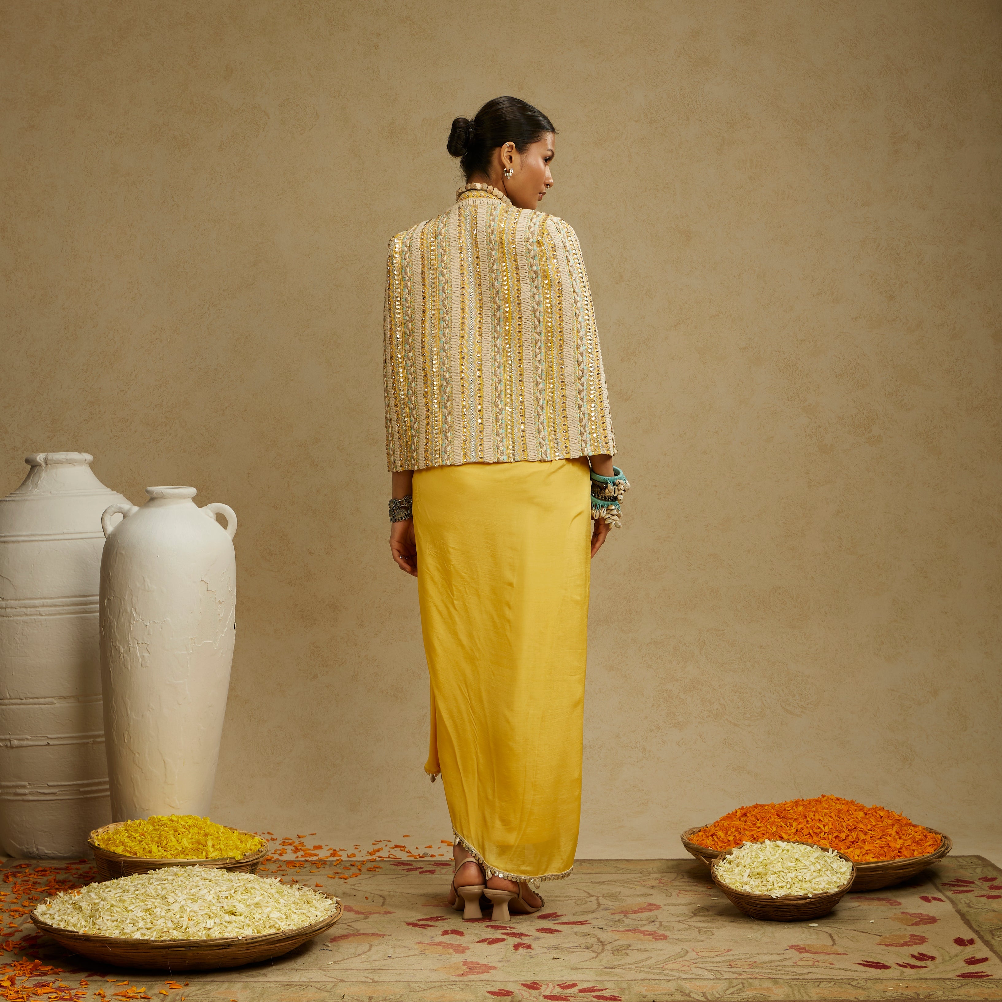 DANDELION EMBELLISHED JACKET PAIRED WITH EMBELLISHED BUSTIER AND HIGH SLIT SKIRT