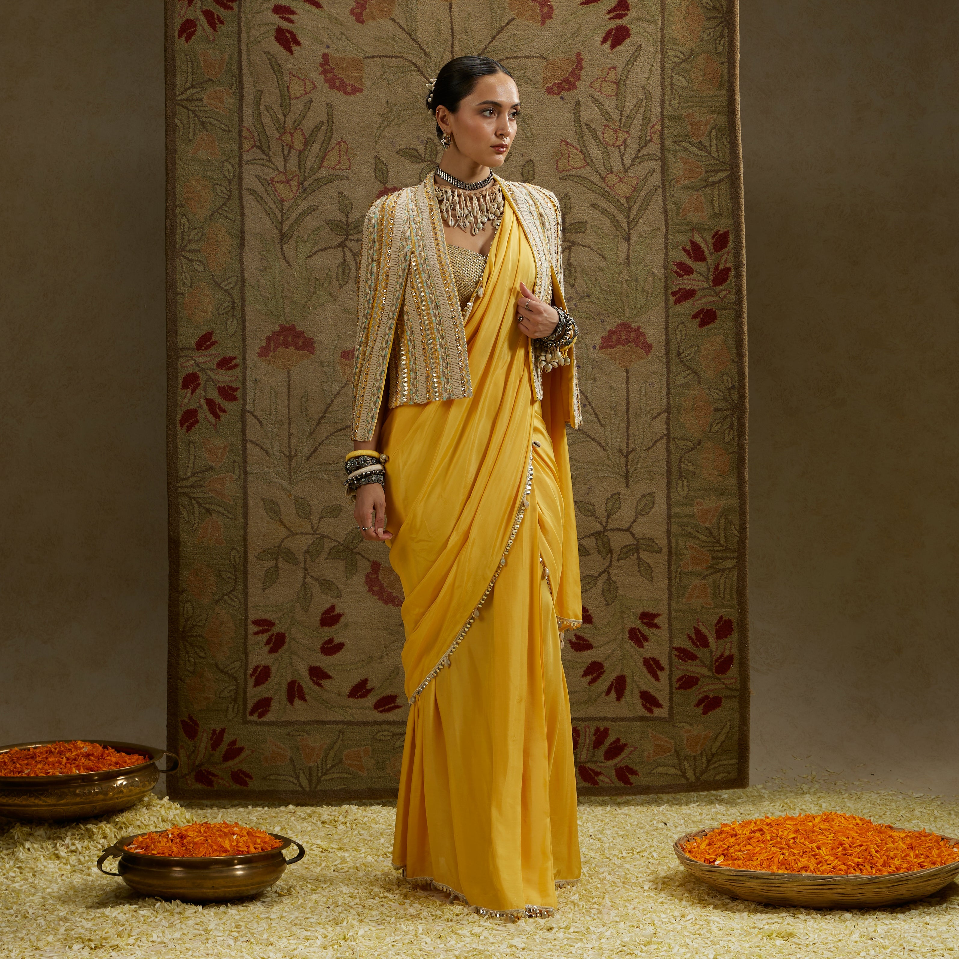 Dandelion Pre-Draped Saree Paired With Metal Embellished Bustier And Embellished Cape Jacket