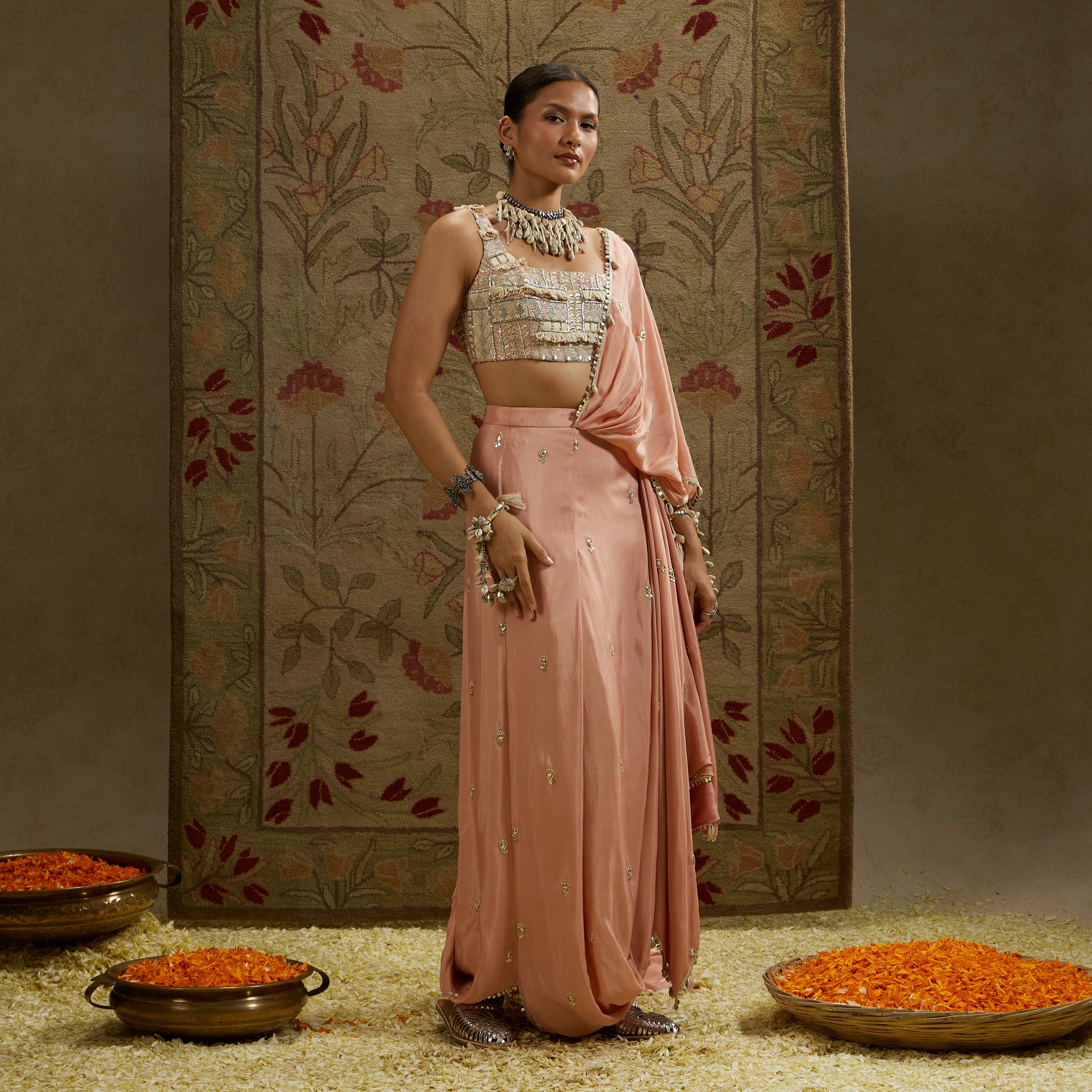 PINK EMBELLISHED SAREE PAIRED WITH EMBELLISHED BUSTIER AND DRAPED SKIRT