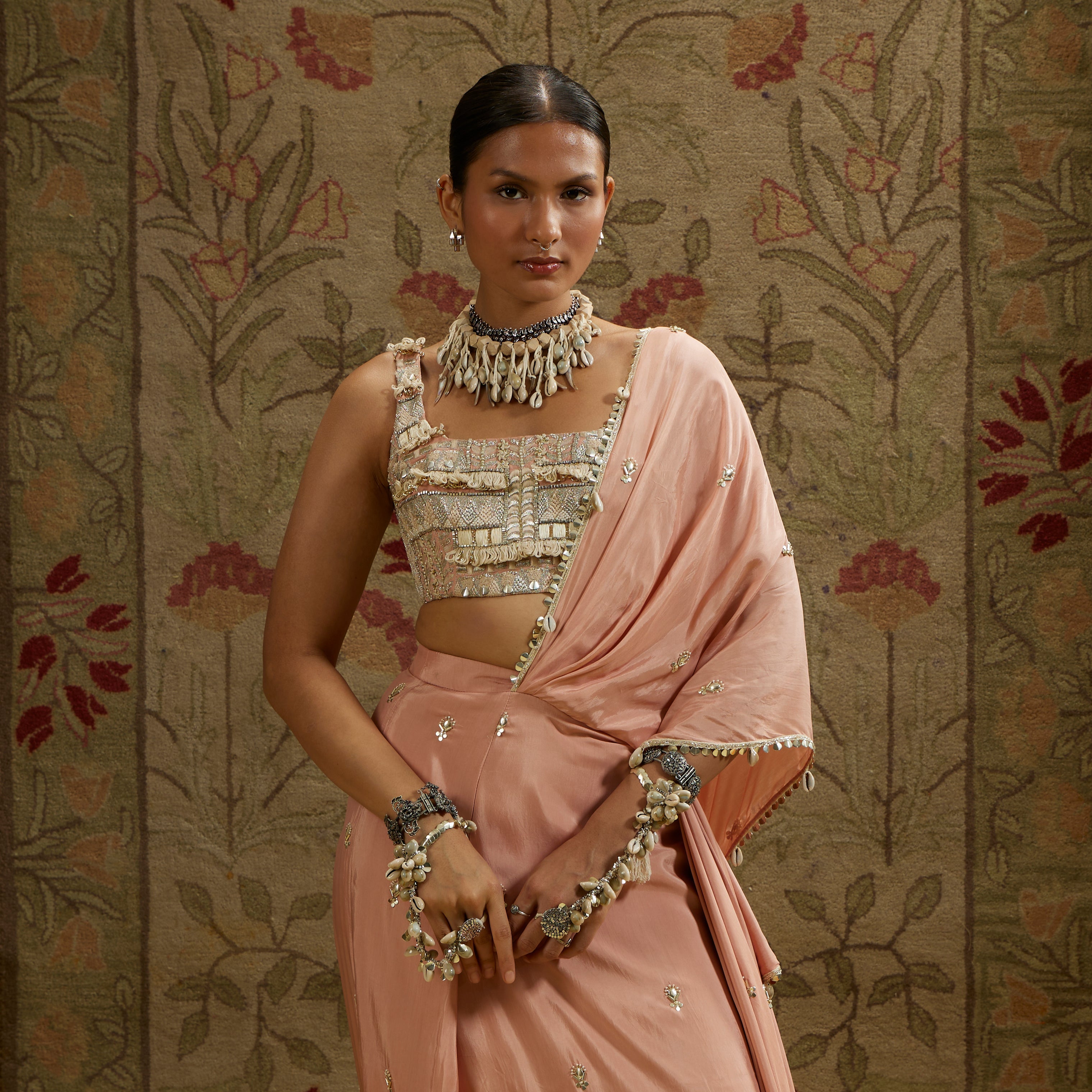 PINK EMBELLISHED SAREE PAIRED WITH EMBELLISHED BUSTIER AND DRAPED SKIRT