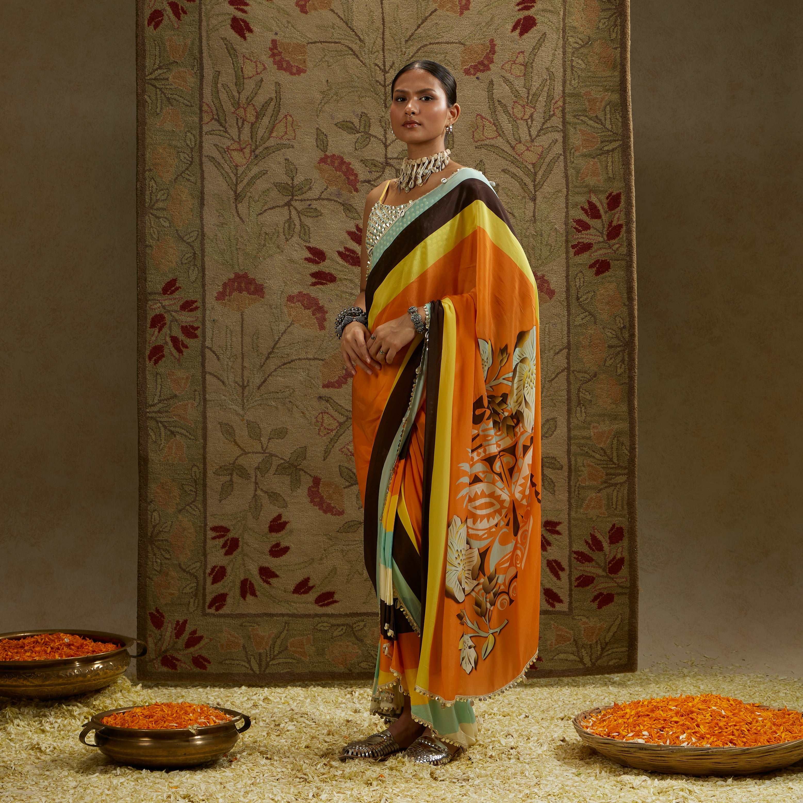 ORANGE MASK PRINT STRIPE PLEATED SAREE WITH METALLIC SCALLOP BUSTIER