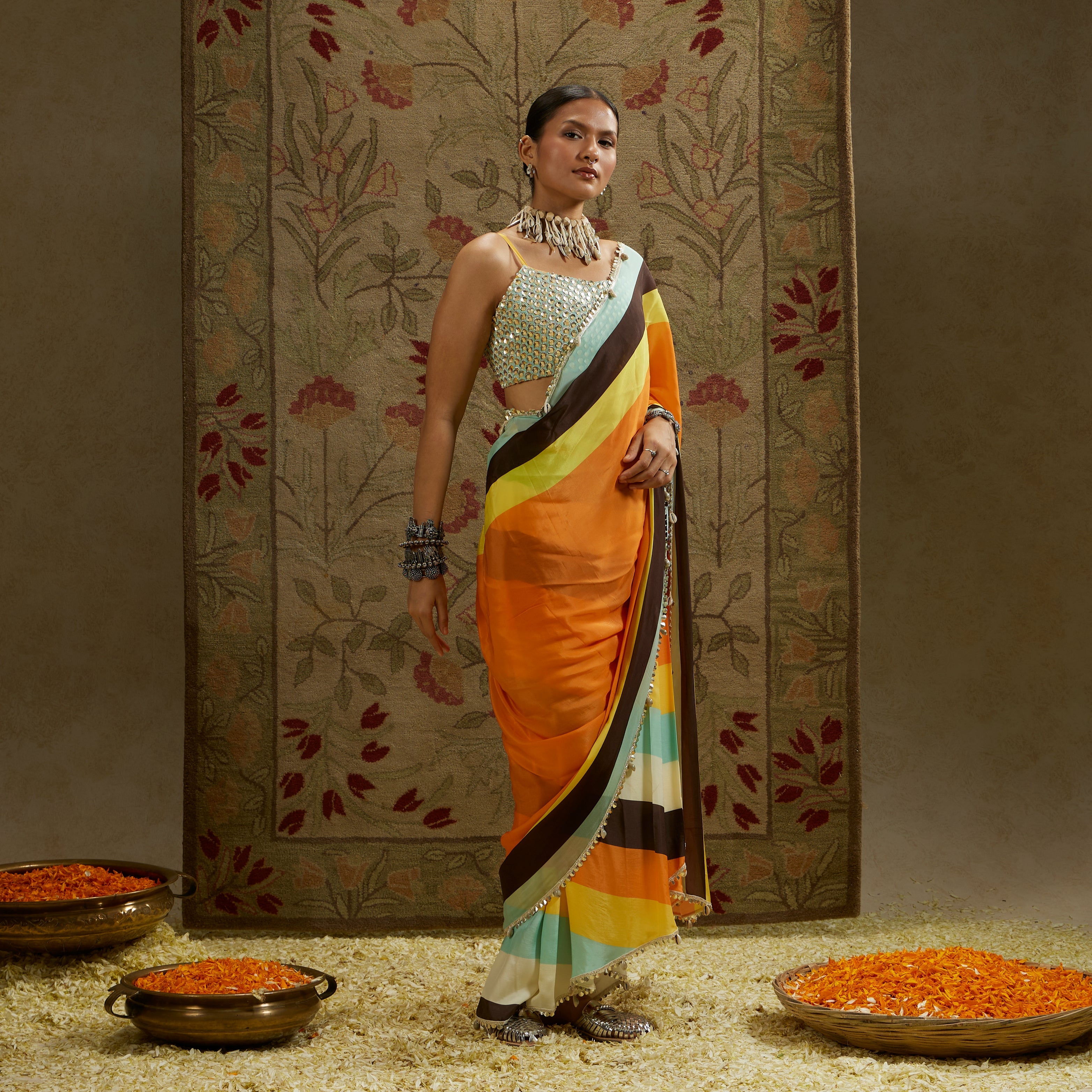 ORANGE MASK PRINT STRIPE PLEATED SAREE WITH METALLIC SCALLOP BUSTIER