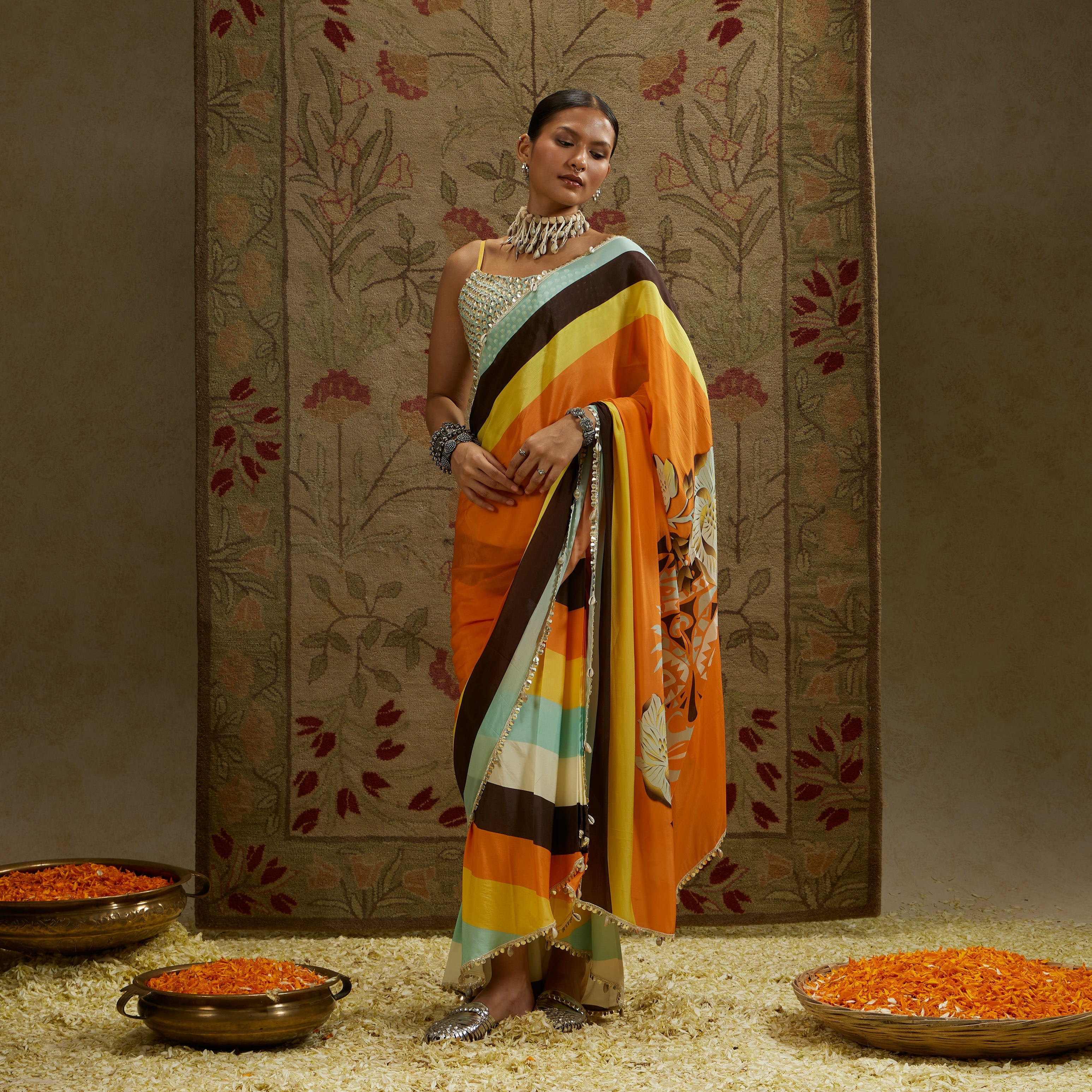 ORANGE MASK PRINT STRIPE PLEATED SAREE WITH METALLIC SCALLOP BUSTIER