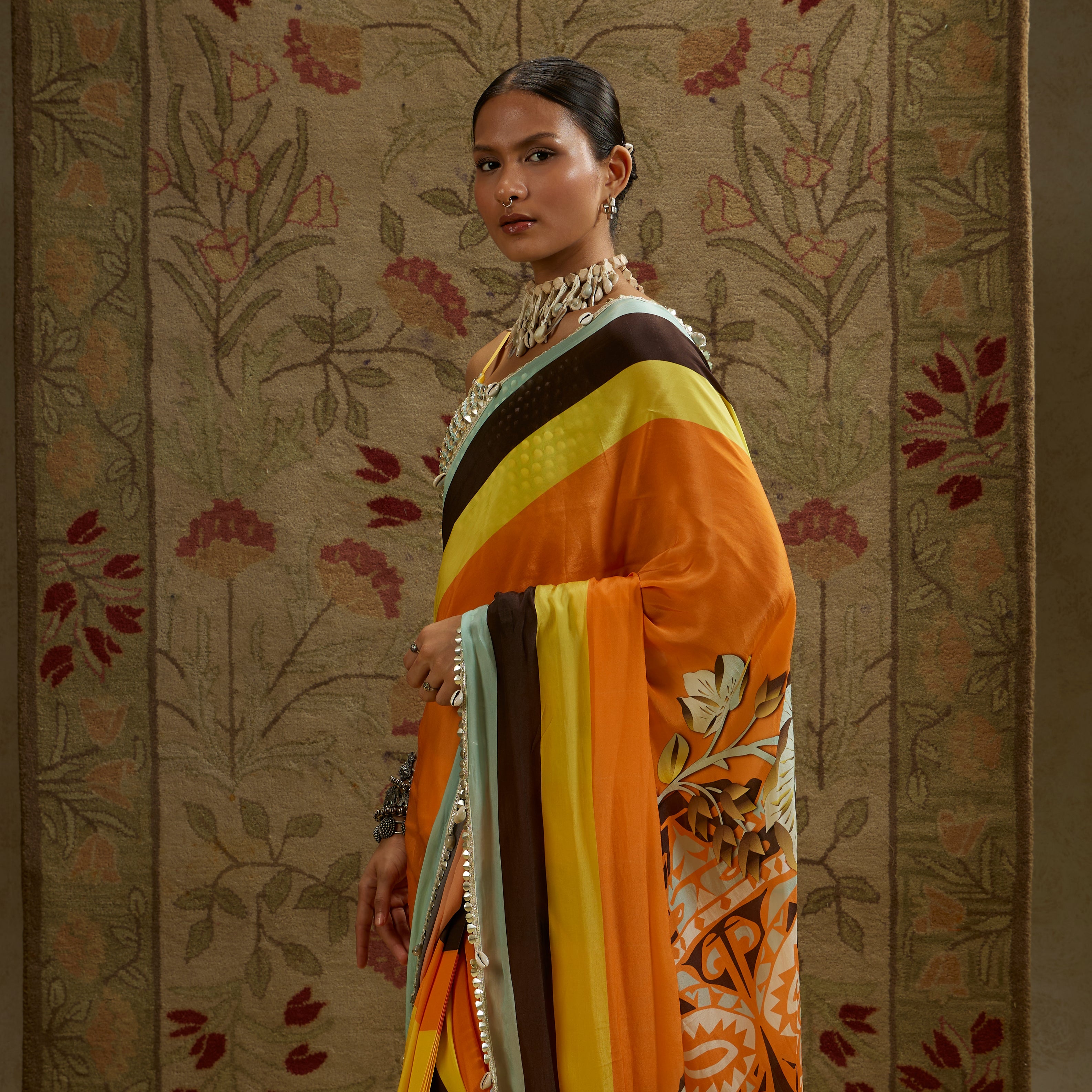 ORANGE MASK PRINT STRIPE PLEATED SAREE WITH METALLIC SCALLOP BUSTIER