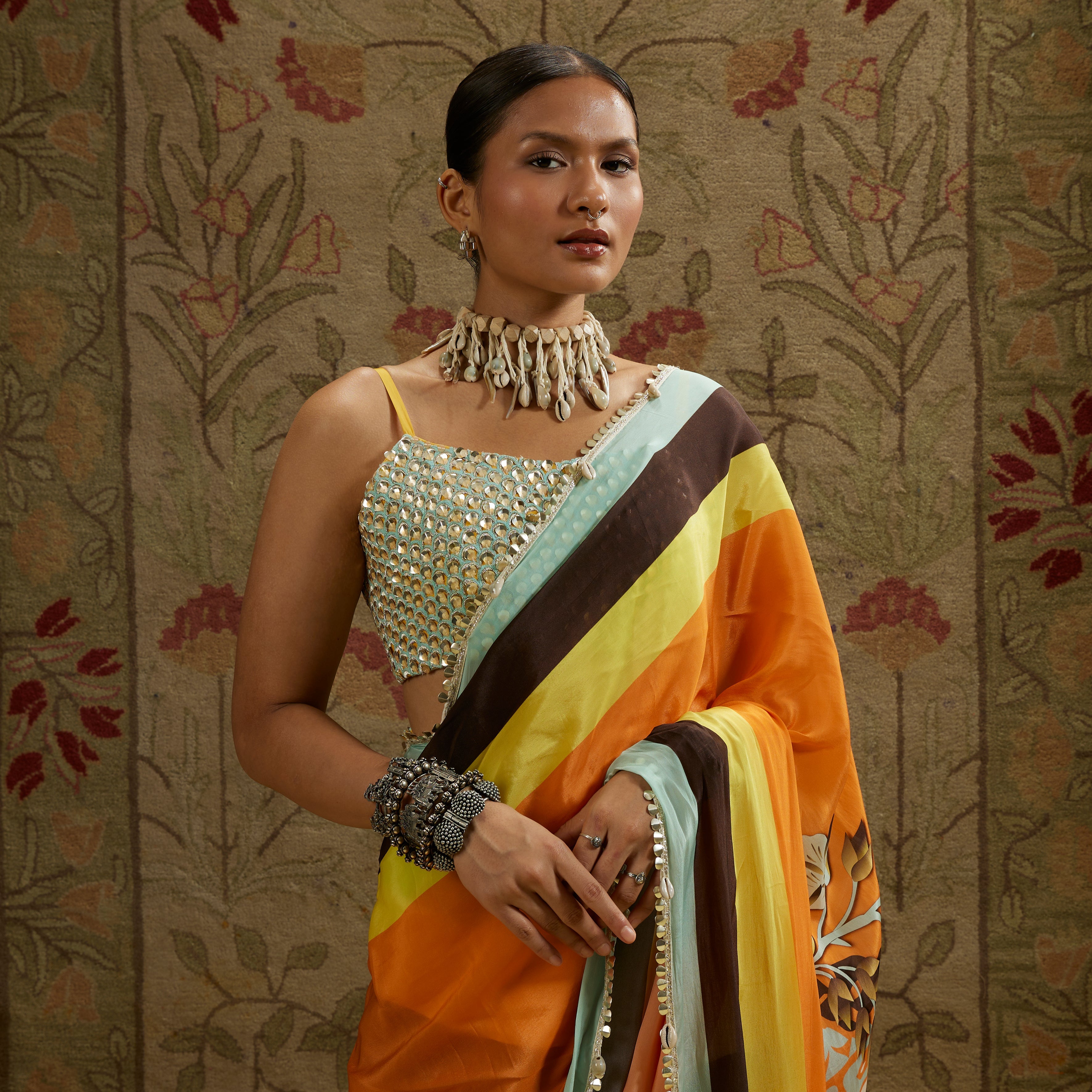 ORANGE MASK PRINT STRIPE PLEATED SAREE WITH METALLIC SCALLOP BUSTIER