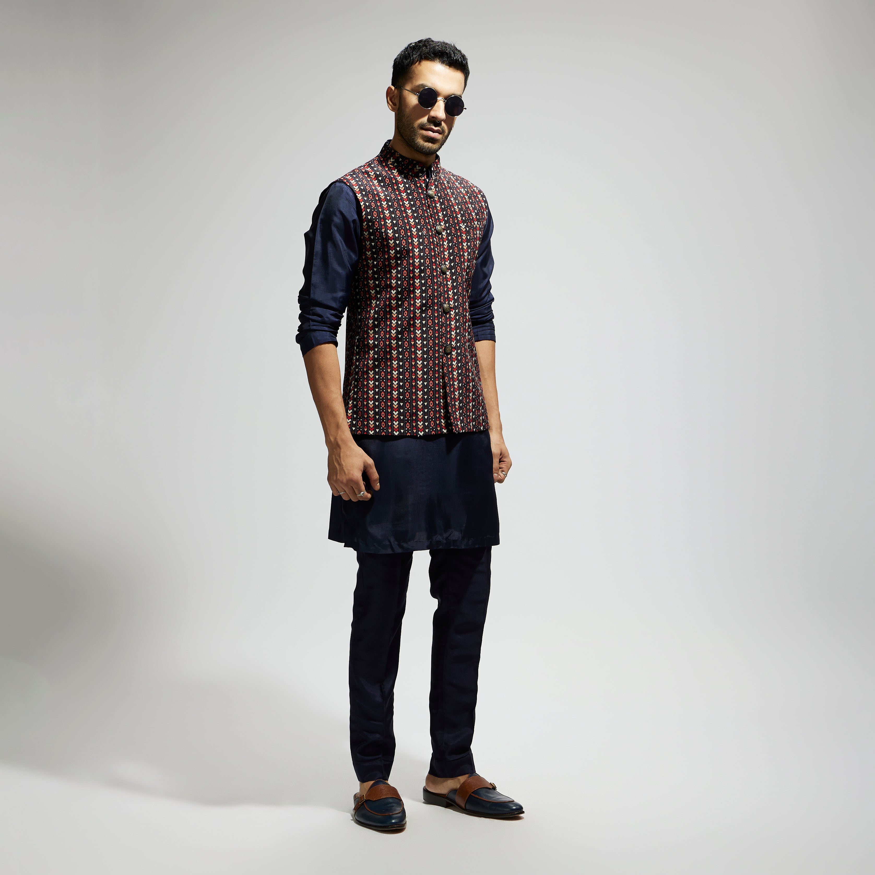 "BLUE BOHO GEO BUNDI
 PAIRED WITH SOLID BLUE KURTA AND PANTS"