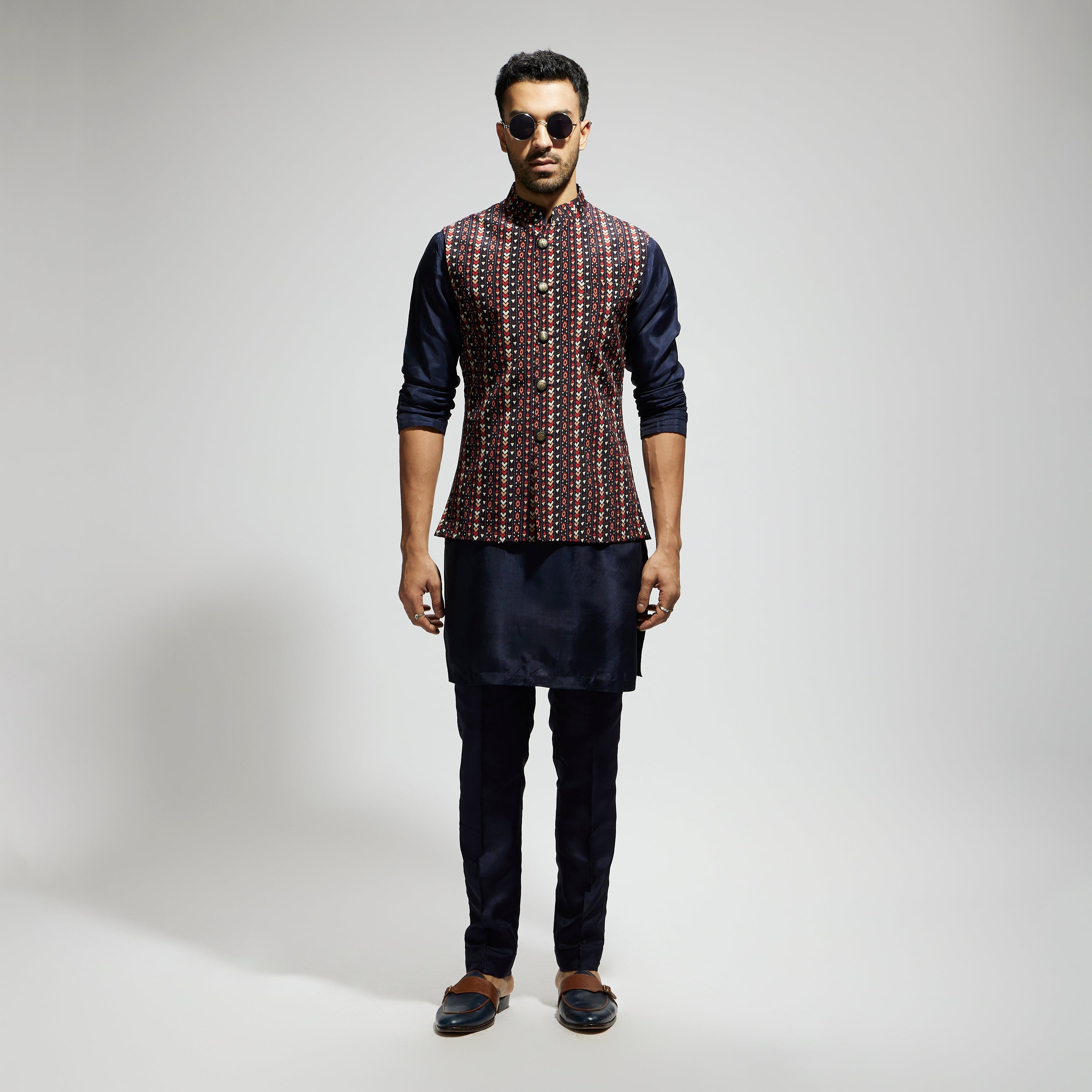 "BLUE BOHO GEO BUNDI
 PAIRED WITH SOLID BLUE KURTA AND PANTS"