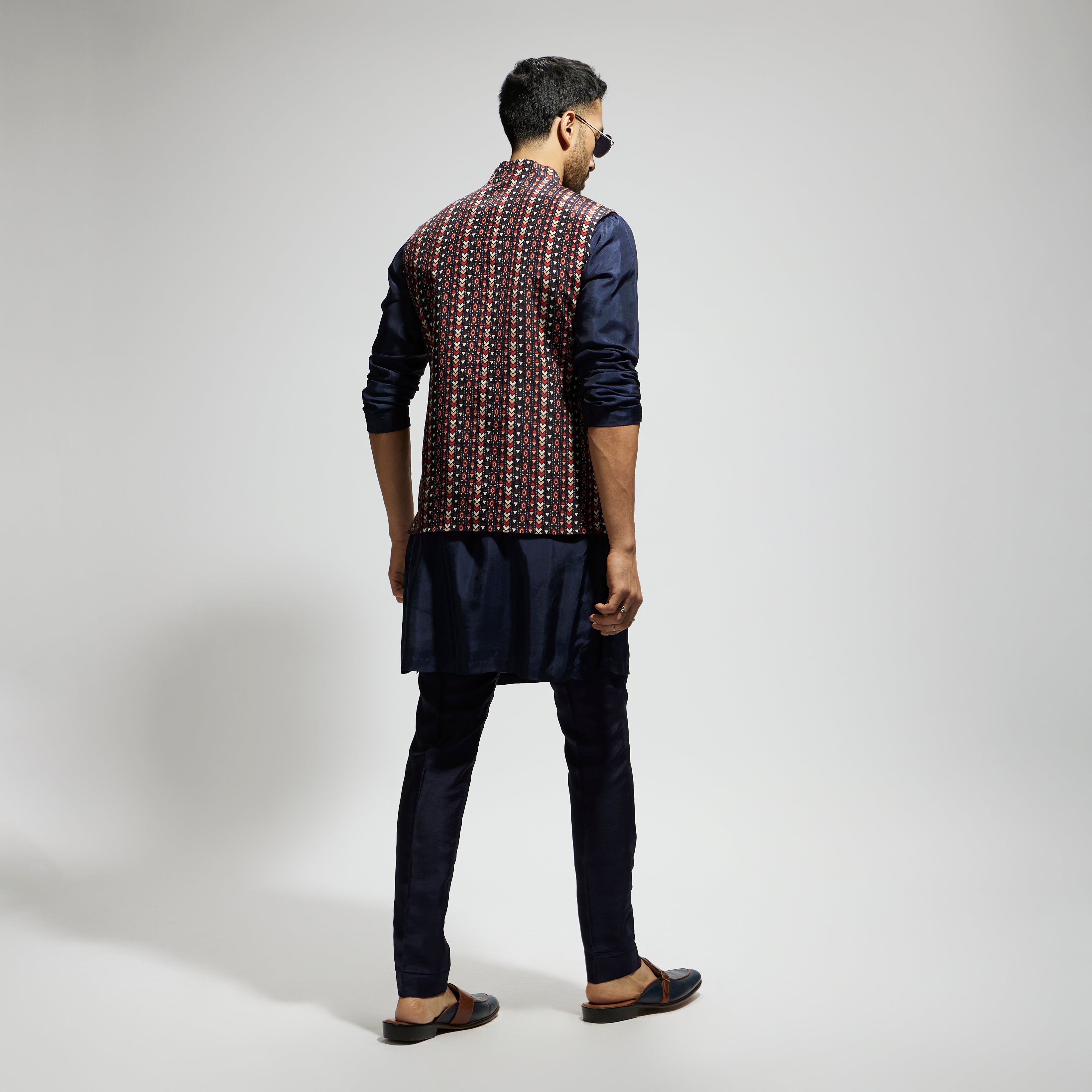 "BLUE BOHO GEO BUNDI
 PAIRED WITH SOLID BLUE KURTA AND PANTS"