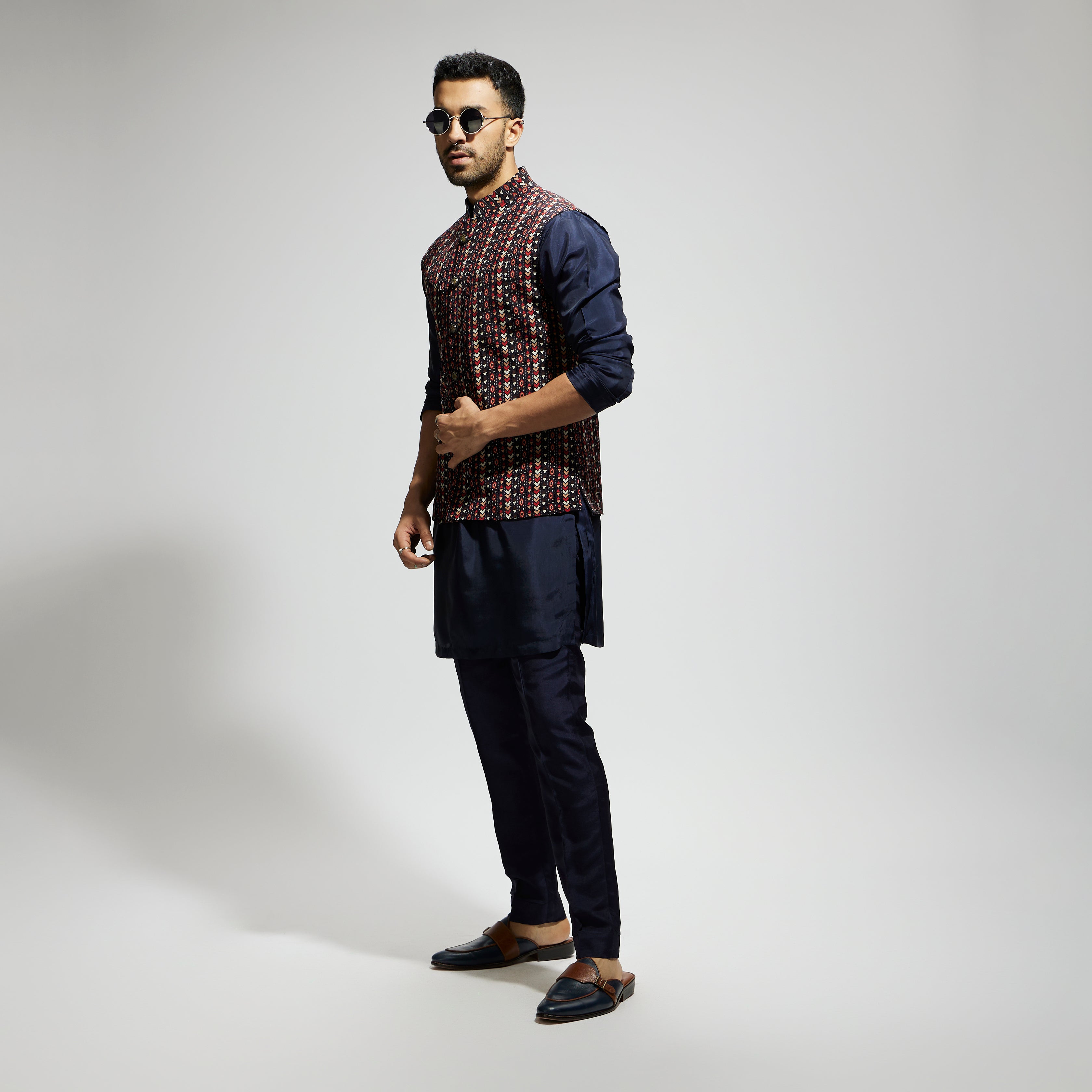 "BLUE BOHO GEO BUNDI
 PAIRED WITH SOLID BLUE KURTA AND PANTS"