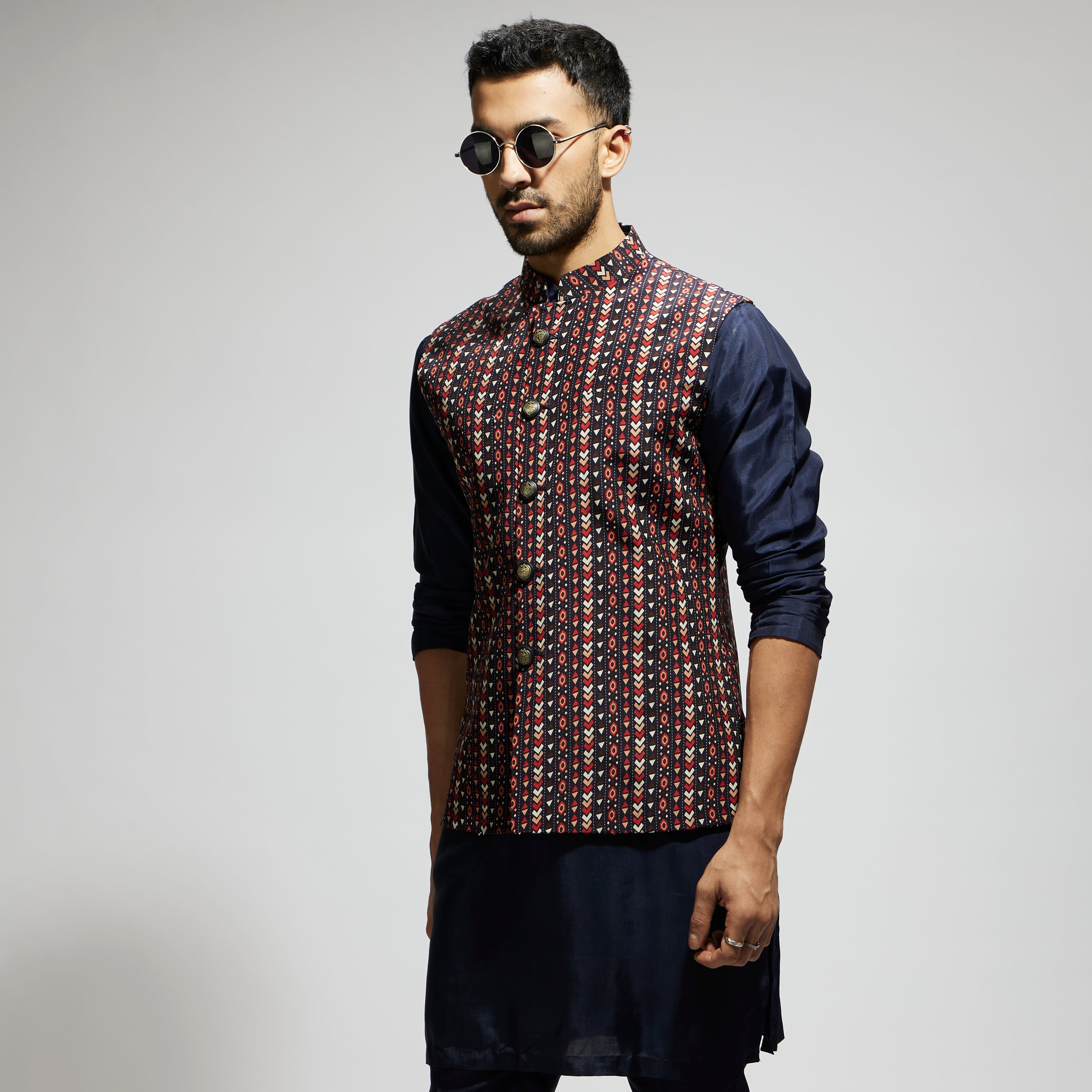 "BLUE BOHO GEO BUNDI
 PAIRED WITH SOLID BLUE KURTA AND PANTS"