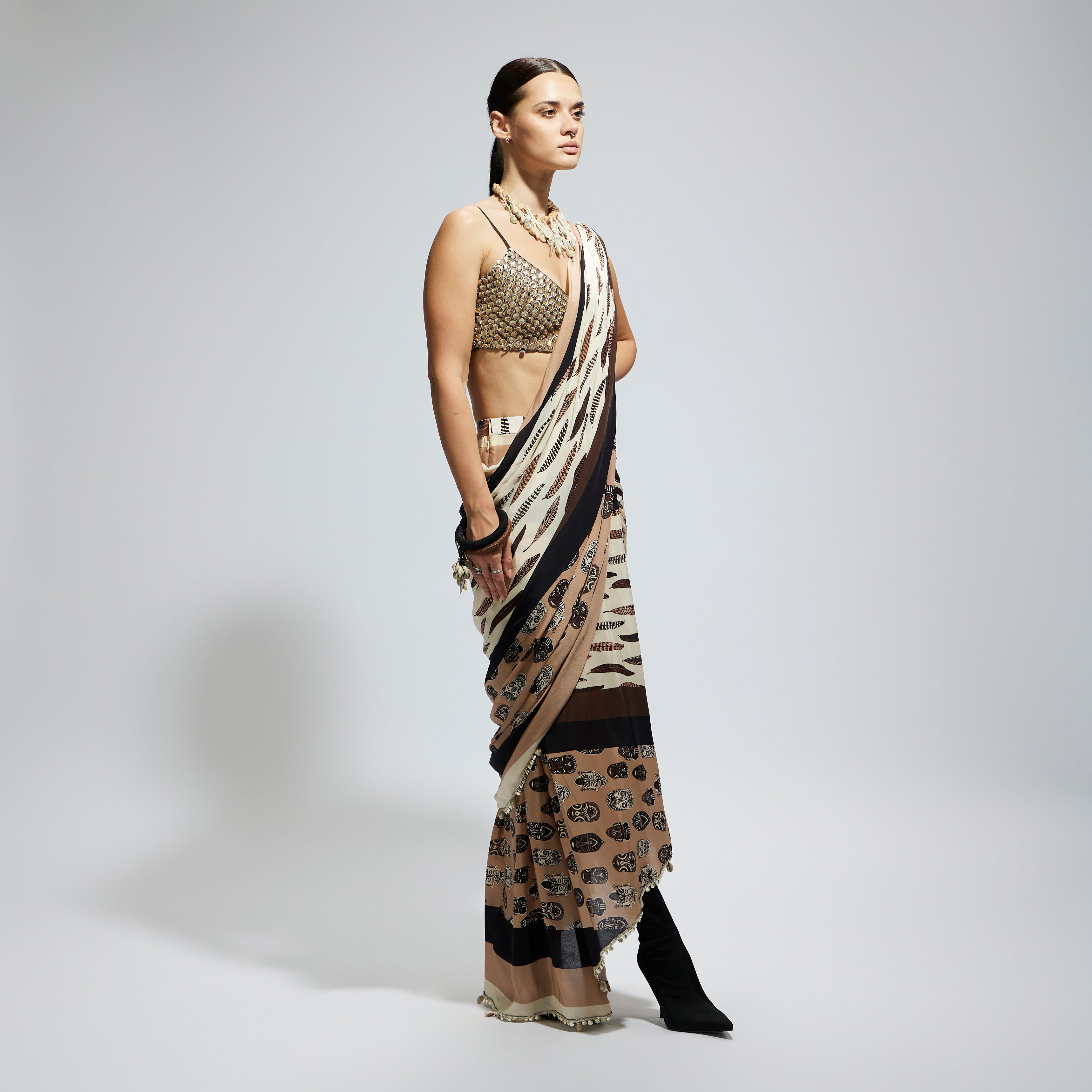 MASK AND FEATHER PRINT CASCADE SAREE PAIRED WITH METALLIC SCALLOP BUSTIER