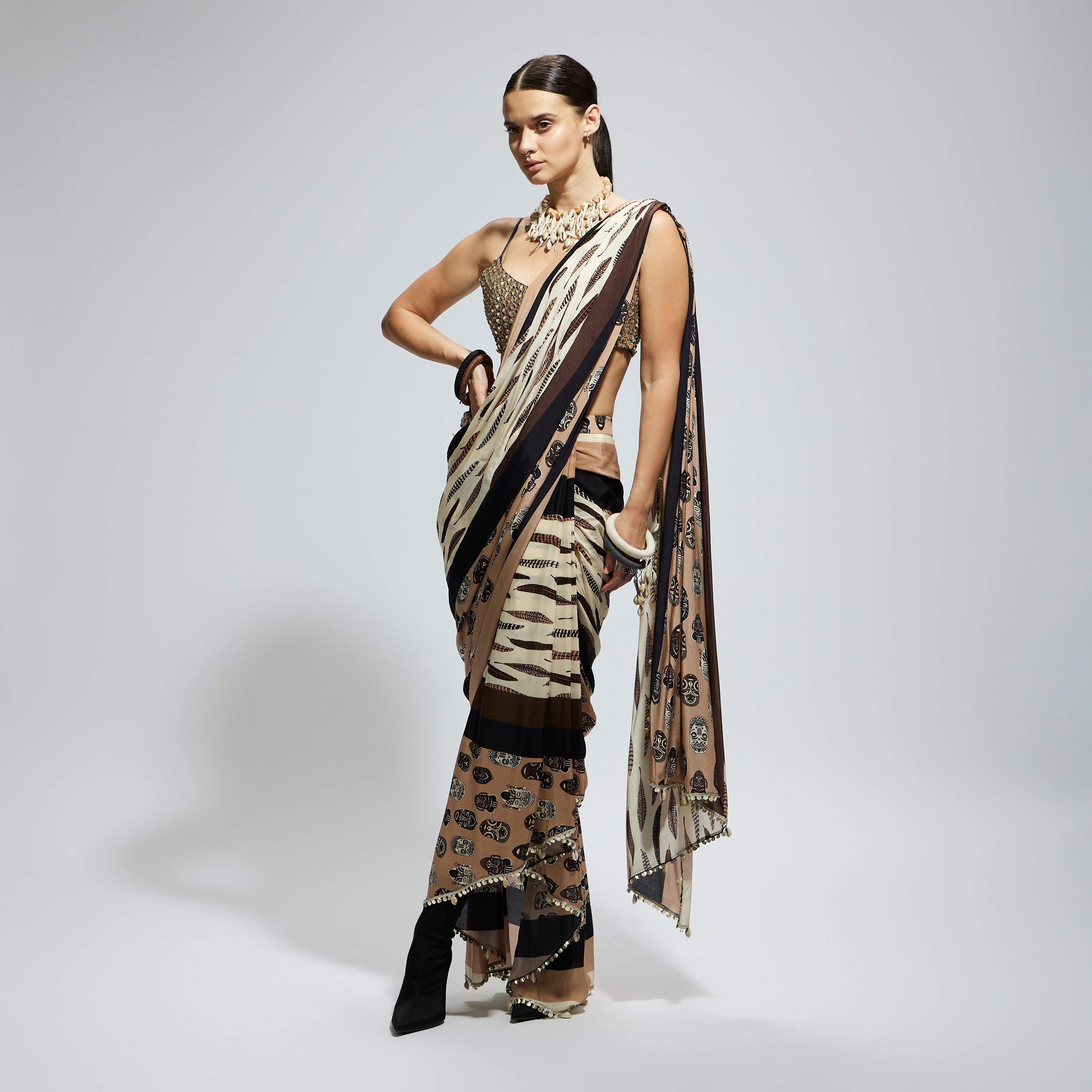 MASK AND FEATHER PRINT CASCADE SAREE PAIRED WITH METALLIC SCALLOP BUSTIER