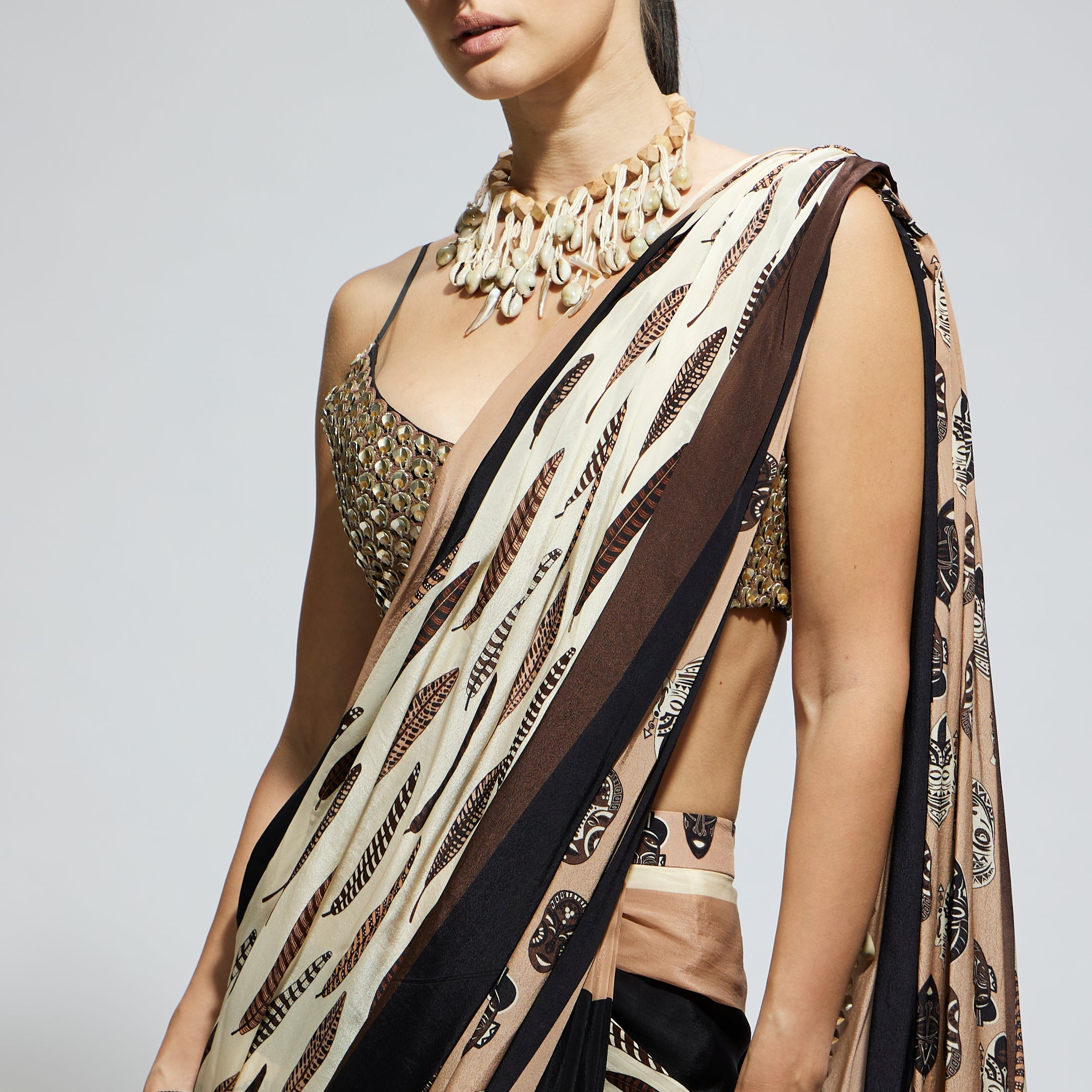 MASK AND FEATHER PRINT CASCADE SAREE PAIRED WITH METALLIC SCALLOP BUSTIER