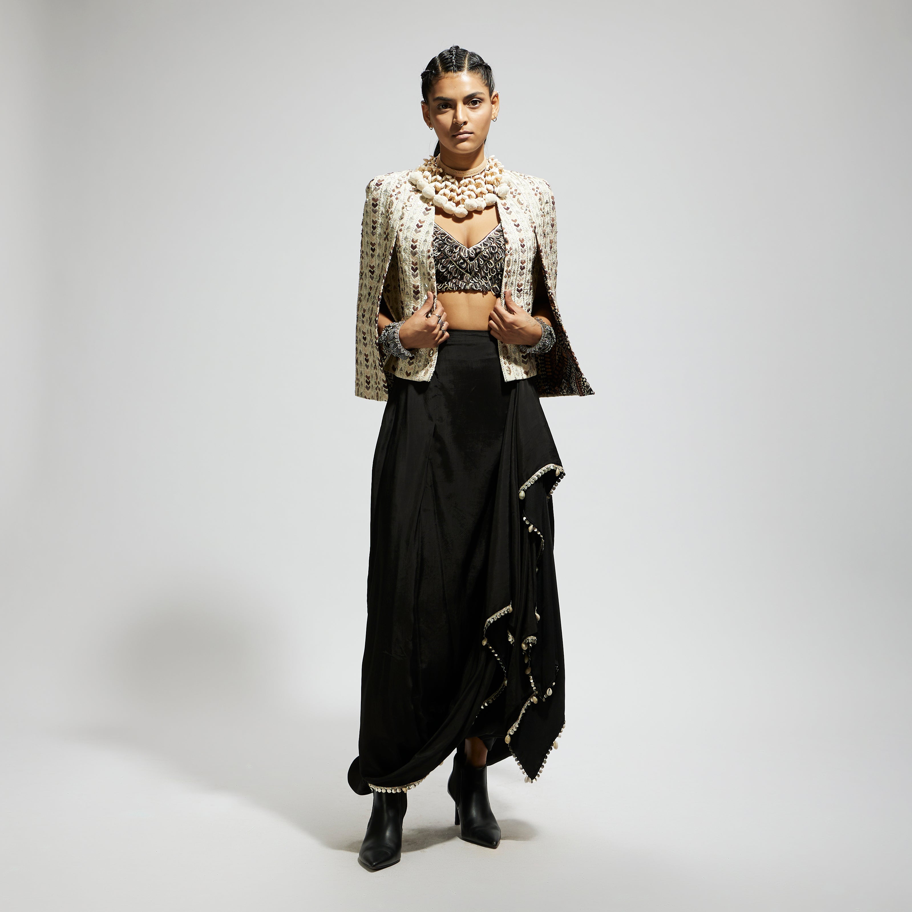 SAMSARA: IVORY EMBELLISHED CAPE JACKET PAIRED WITH TEXTURED BUSTIER AND DRAPE SKIRT