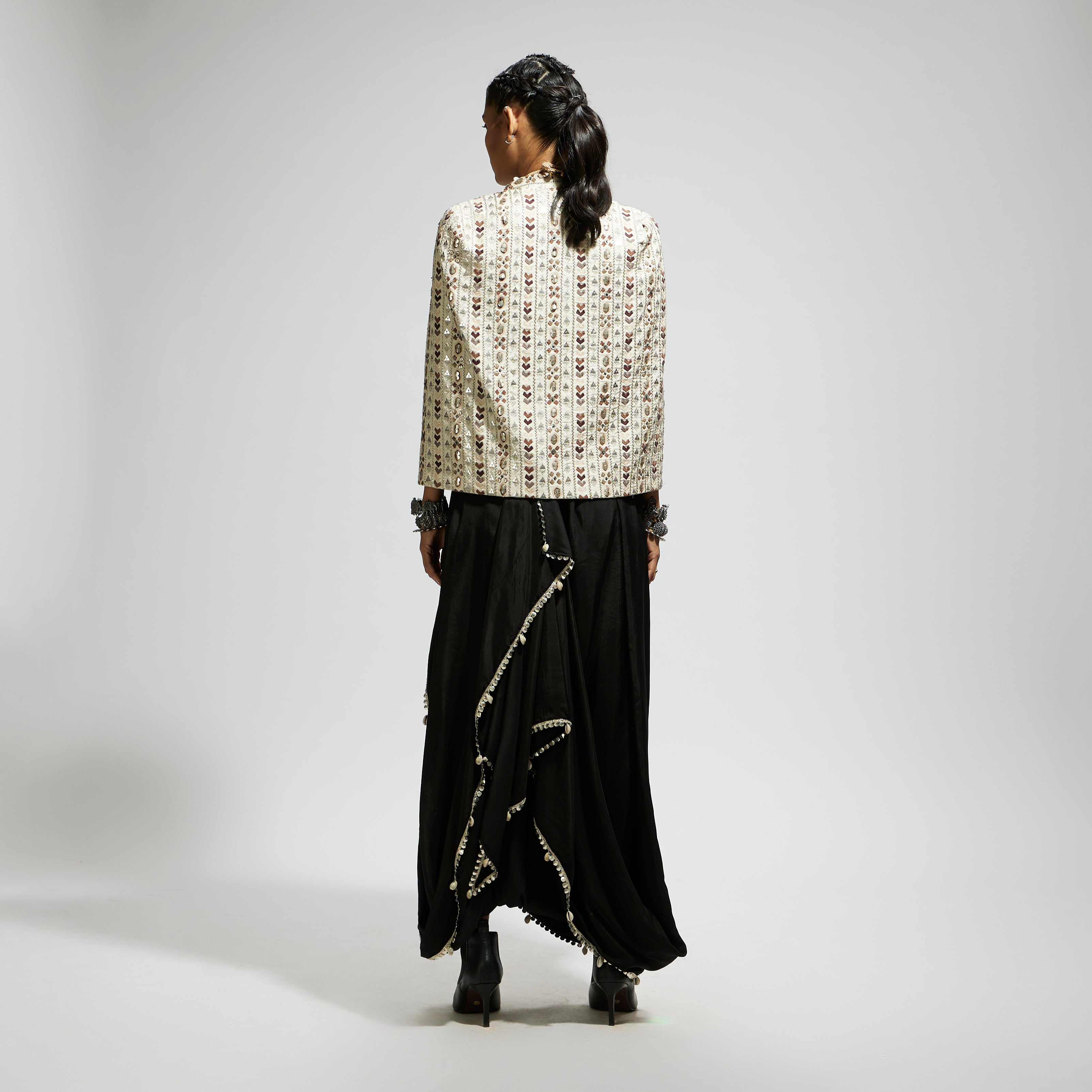 SAMSARA: IVORY EMBELLISHED CAPE JACKET PAIRED WITH TEXTURED BUSTIER AND DRAPE SKIRT