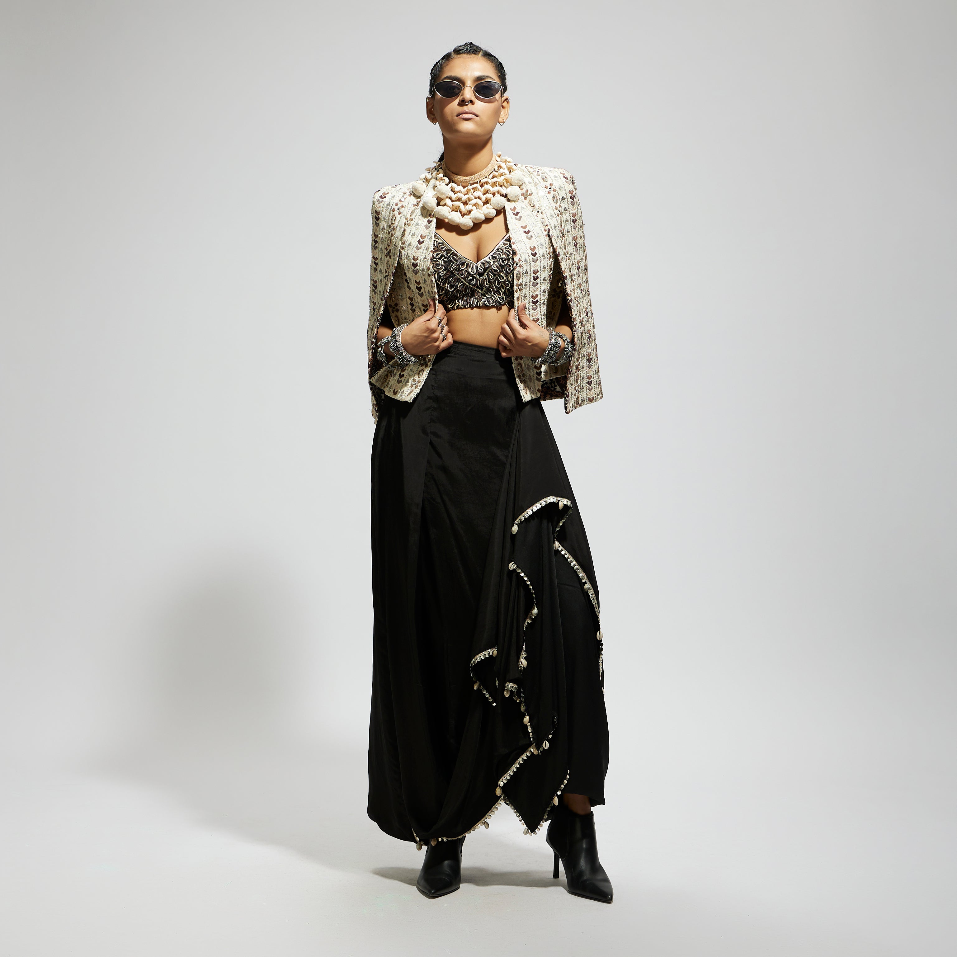 SAMSARA: IVORY EMBELLISHED CAPE JACKET PAIRED WITH TEXTURED BUSTIER AND DRAPE SKIRT