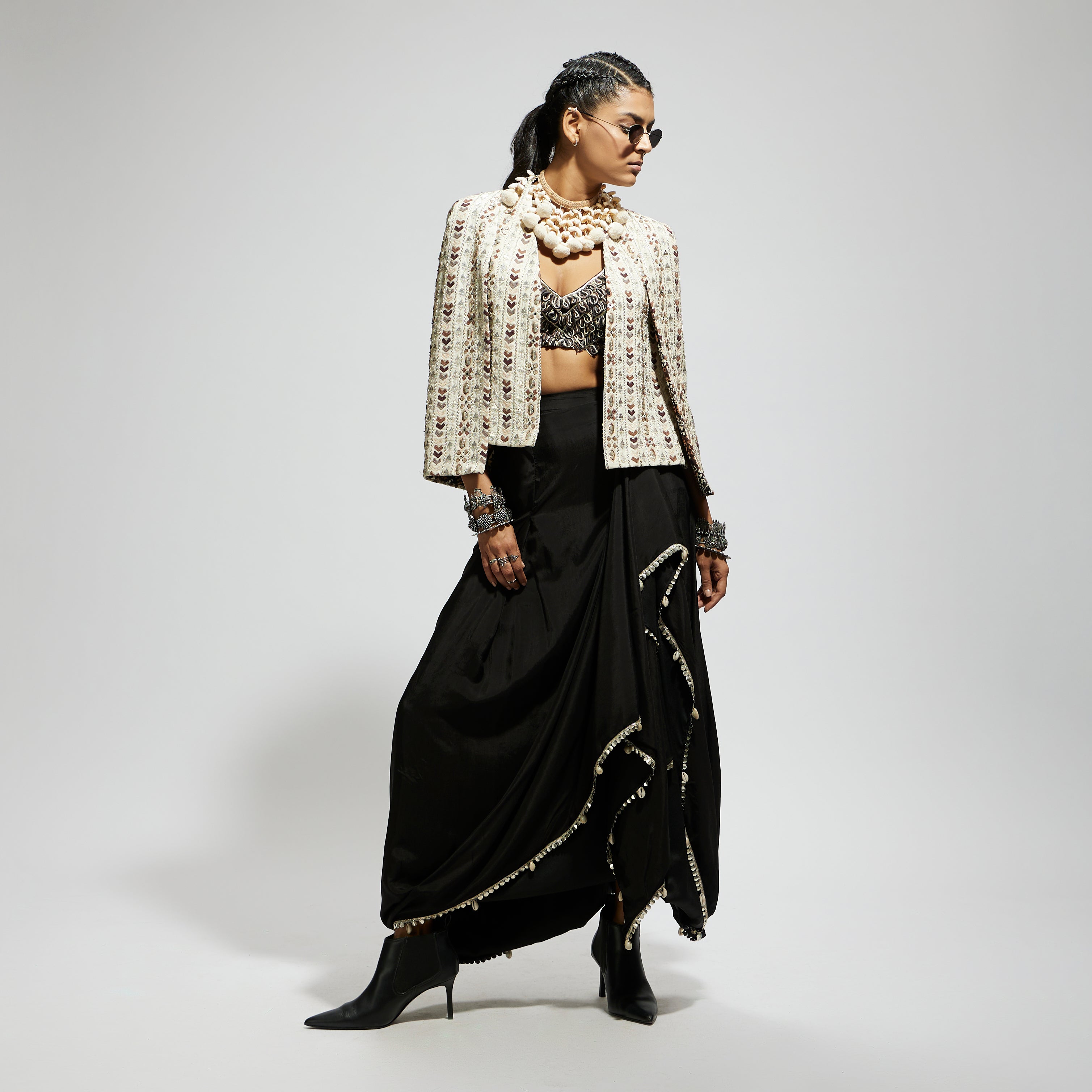 IVORY EMBELLISHED CAPE JACKET PAIRED WITH TEXTURED BUSTIER AND DRAPE SKIRT