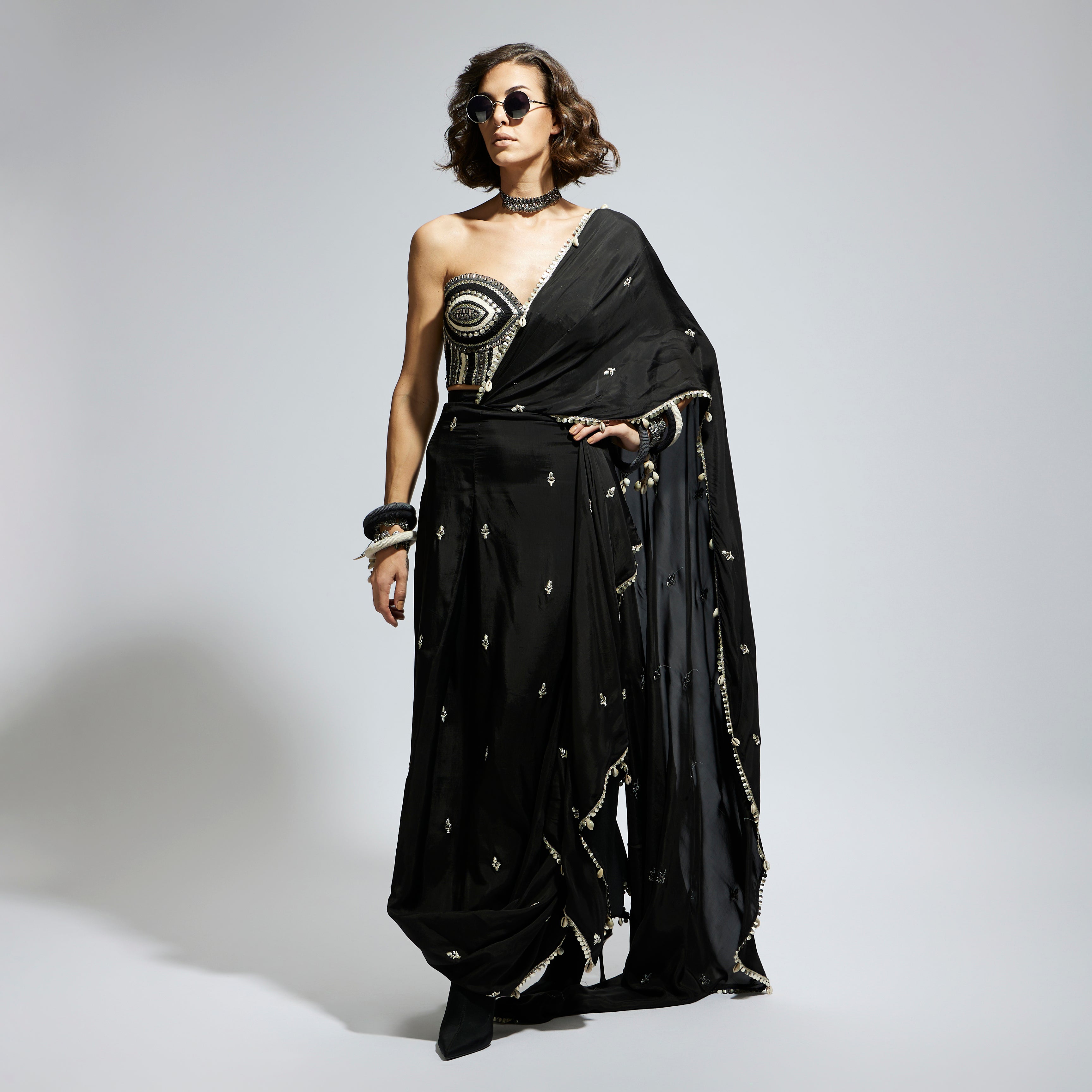 BLACK THREADWORK CORSET PAIRED WITH EMBELLISHED SAREE DRAPED SKIRT