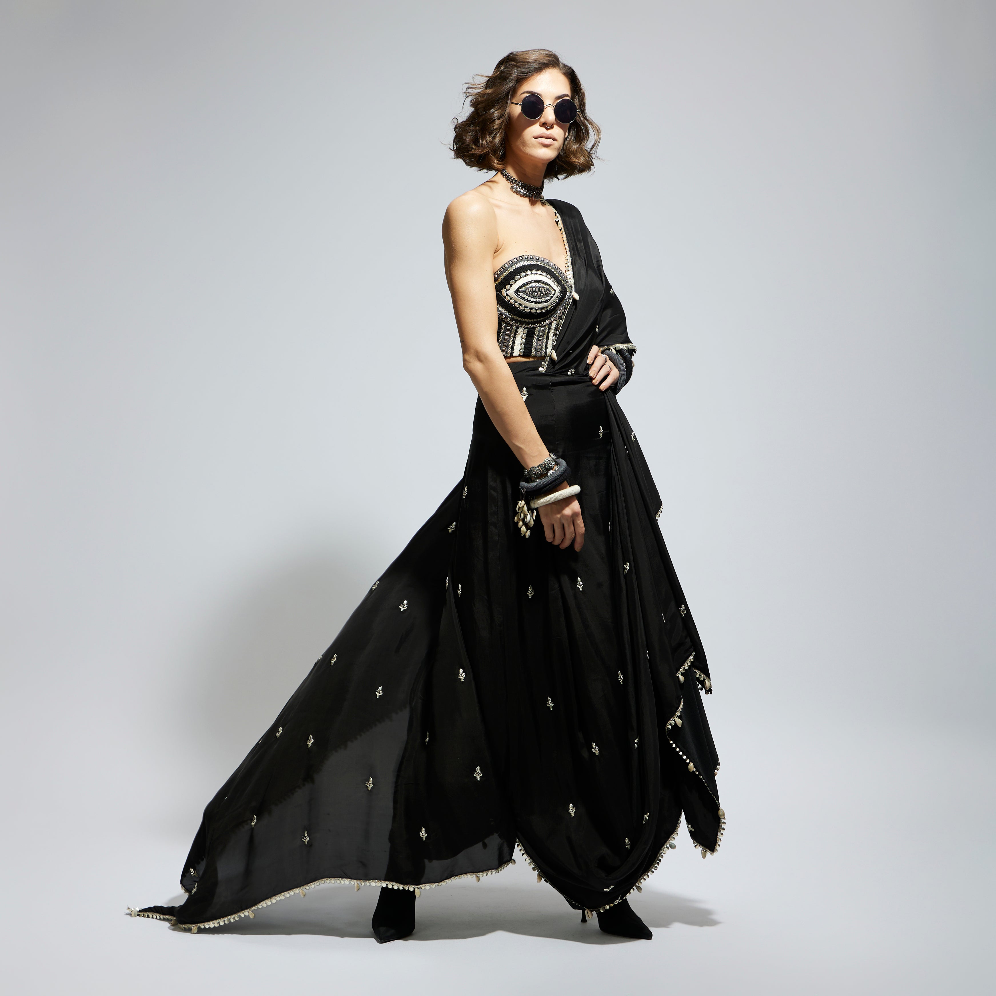 BLACK THREADWORK CORSET PAIRED WITH EMBELLISHED SAREE DRAPED SKIRT