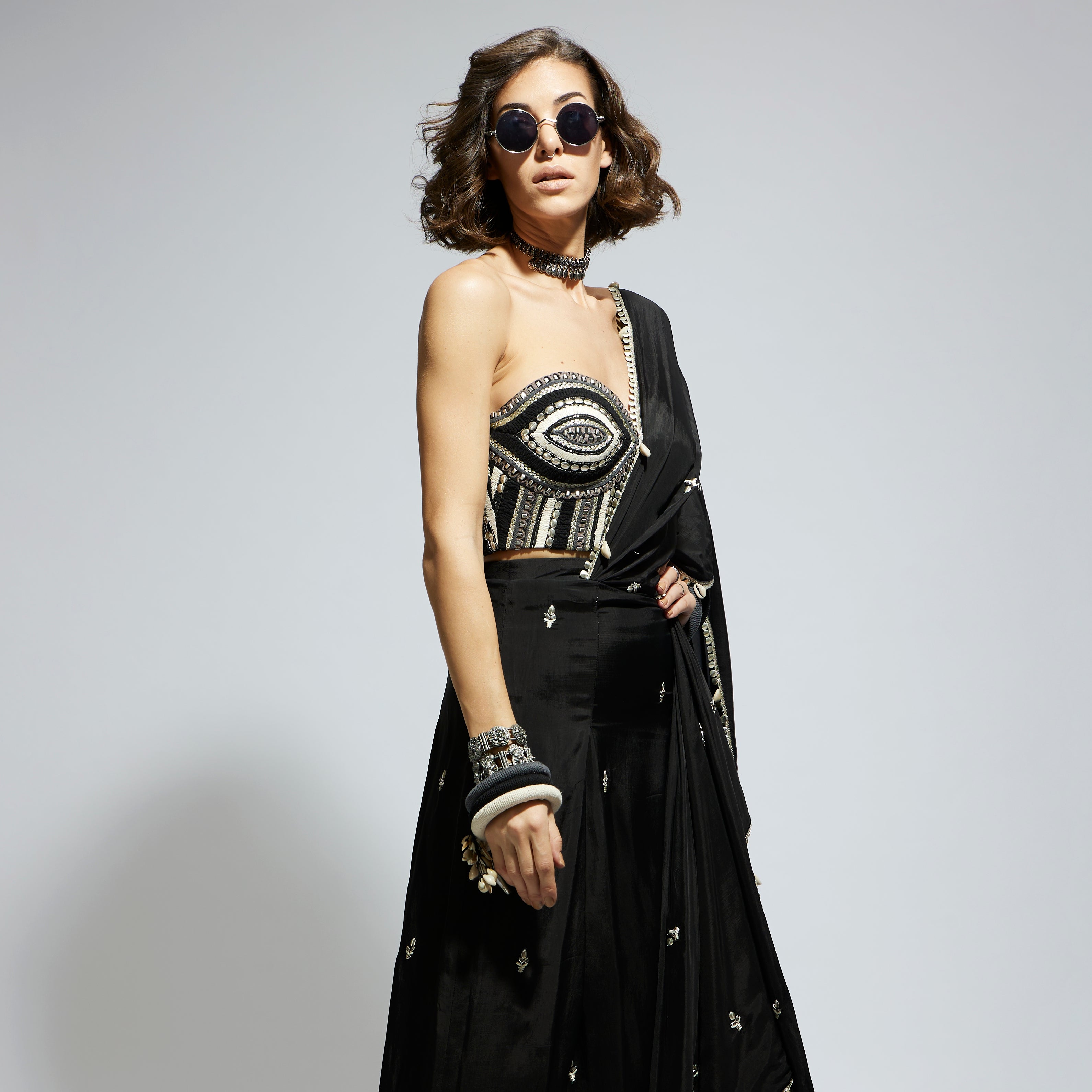 SAMSARA: BLACK THREADWORK CORSET PAIRED WITH EMBELLISHED SAREE DRAPED SKIRT