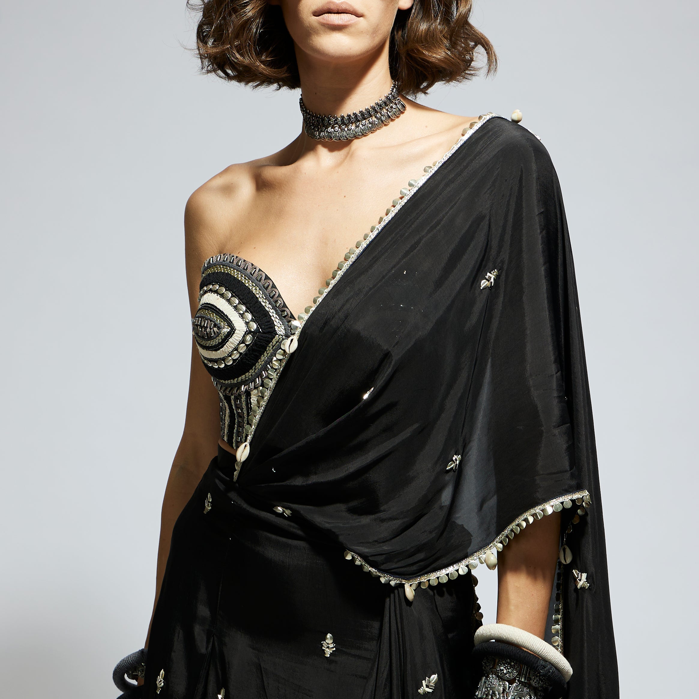 BLACK THREADWORK CORSET PAIRED WITH EMBELLISHED SAREE DRAPED SKIRT