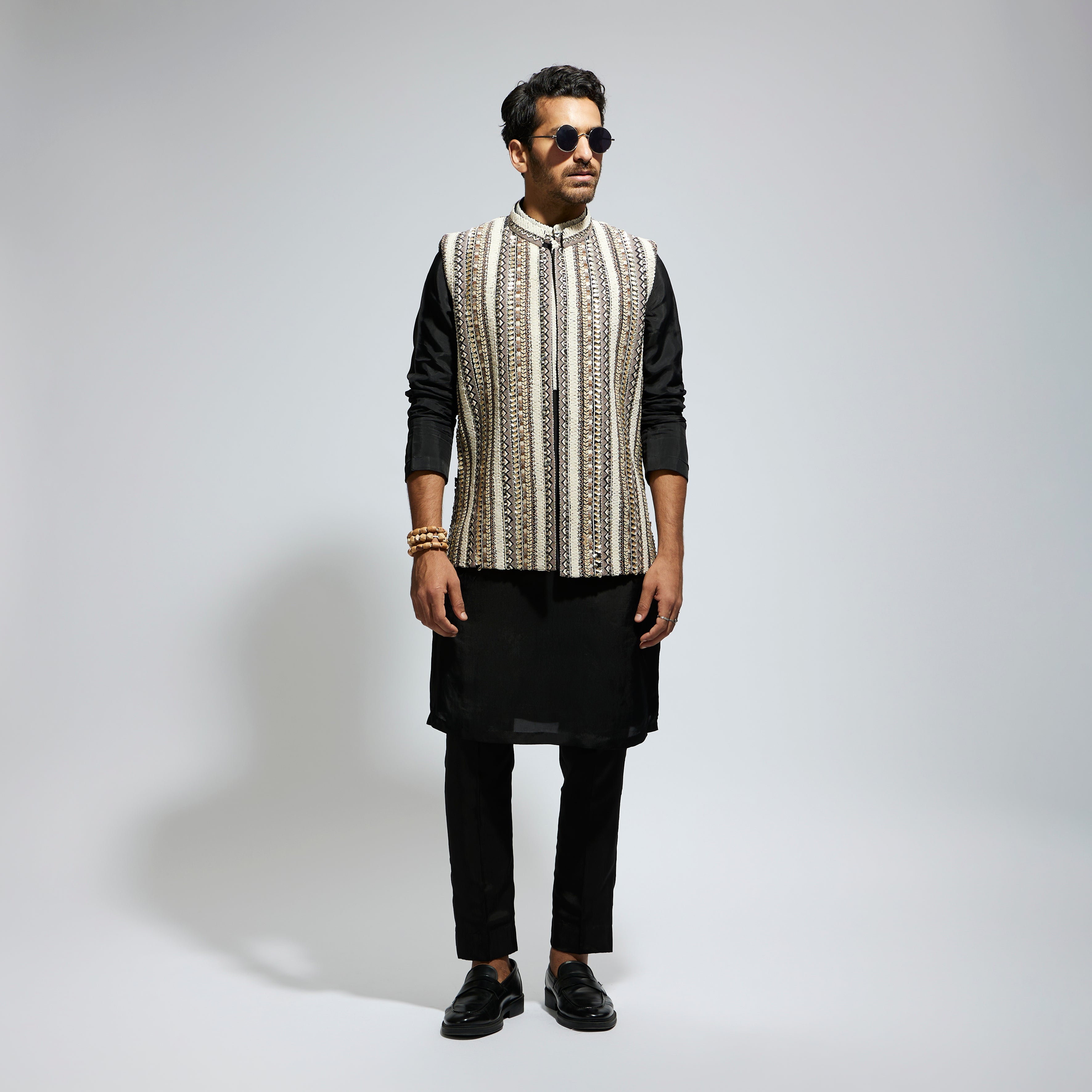 IVORY THREADWORK EMBELLISHED BUNDI
 PAIRED WITH KURTA AND PANTS