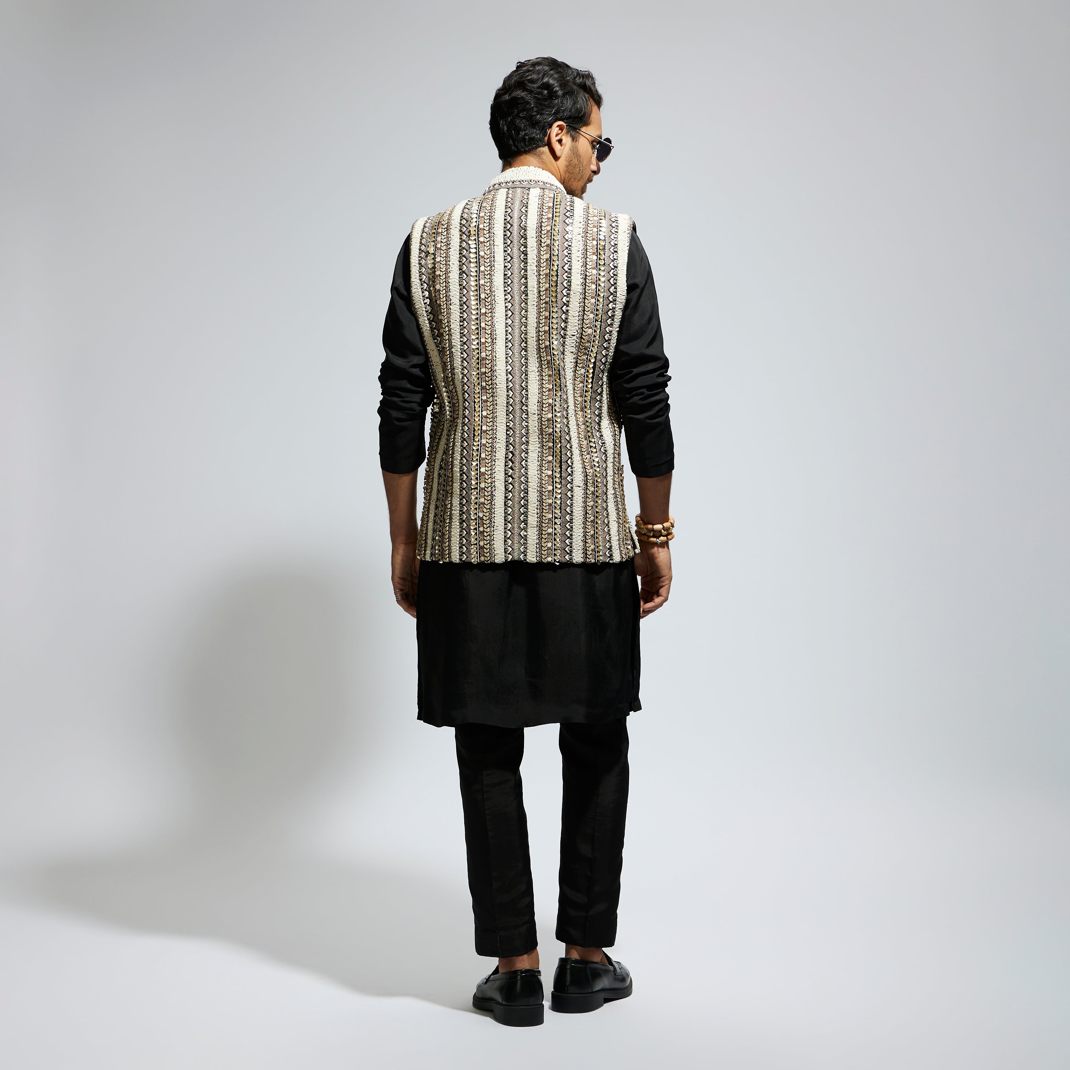 IVORY THREADWORK EMBELLISHED BUNDI
 PAIRED WITH KURTA AND PANTS