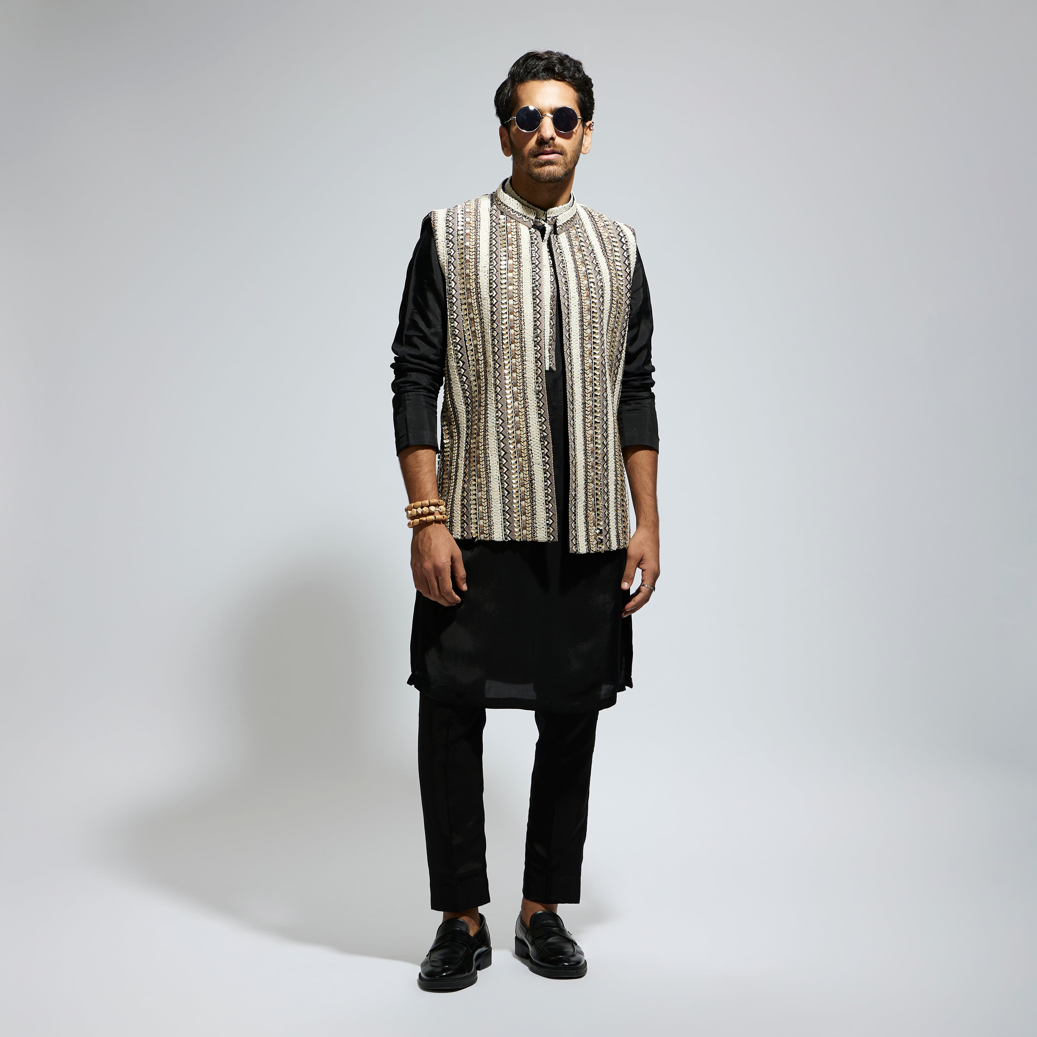 IVORY THREADWORK EMBELLISHED BUNDI
 PAIRED WITH KURTA AND PANTS