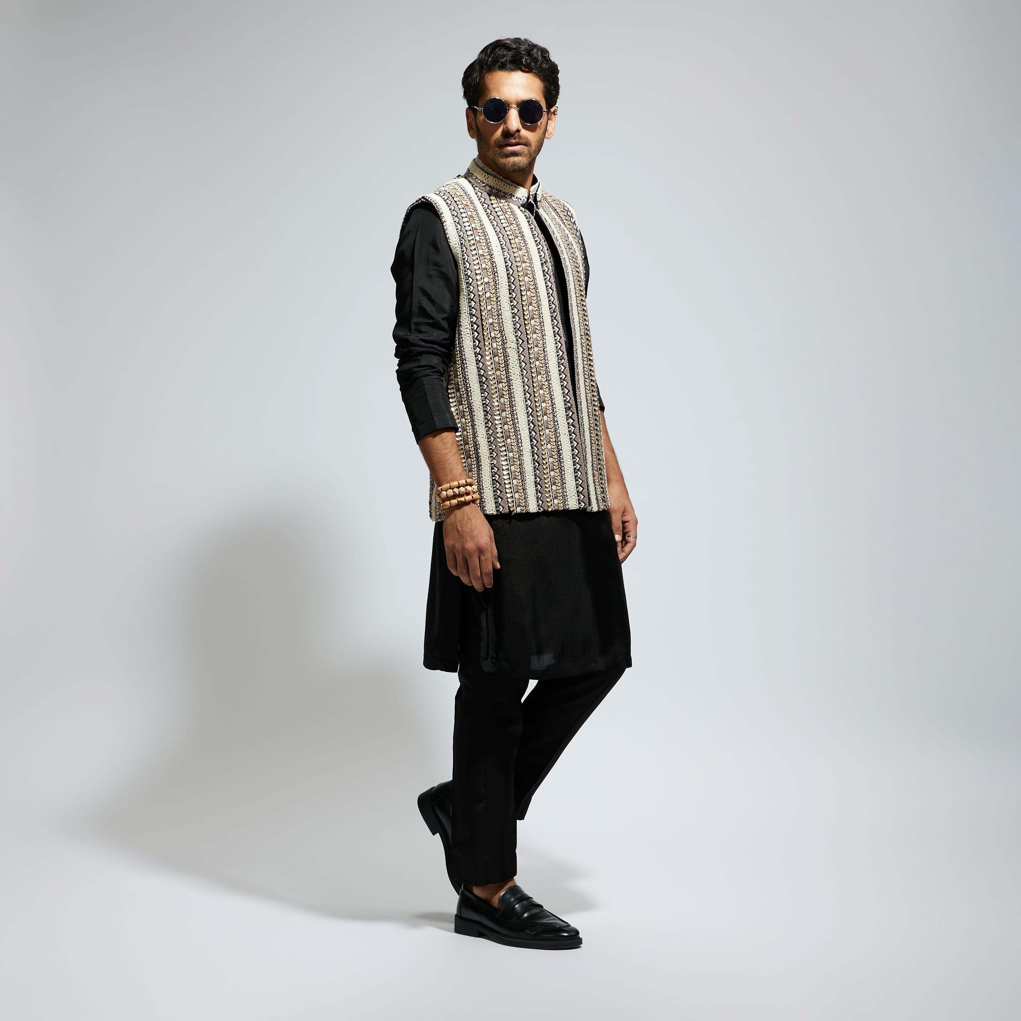 IVORY THREADWORK EMBELLISHED BUNDI
 PAIRED WITH KURTA AND PANTS