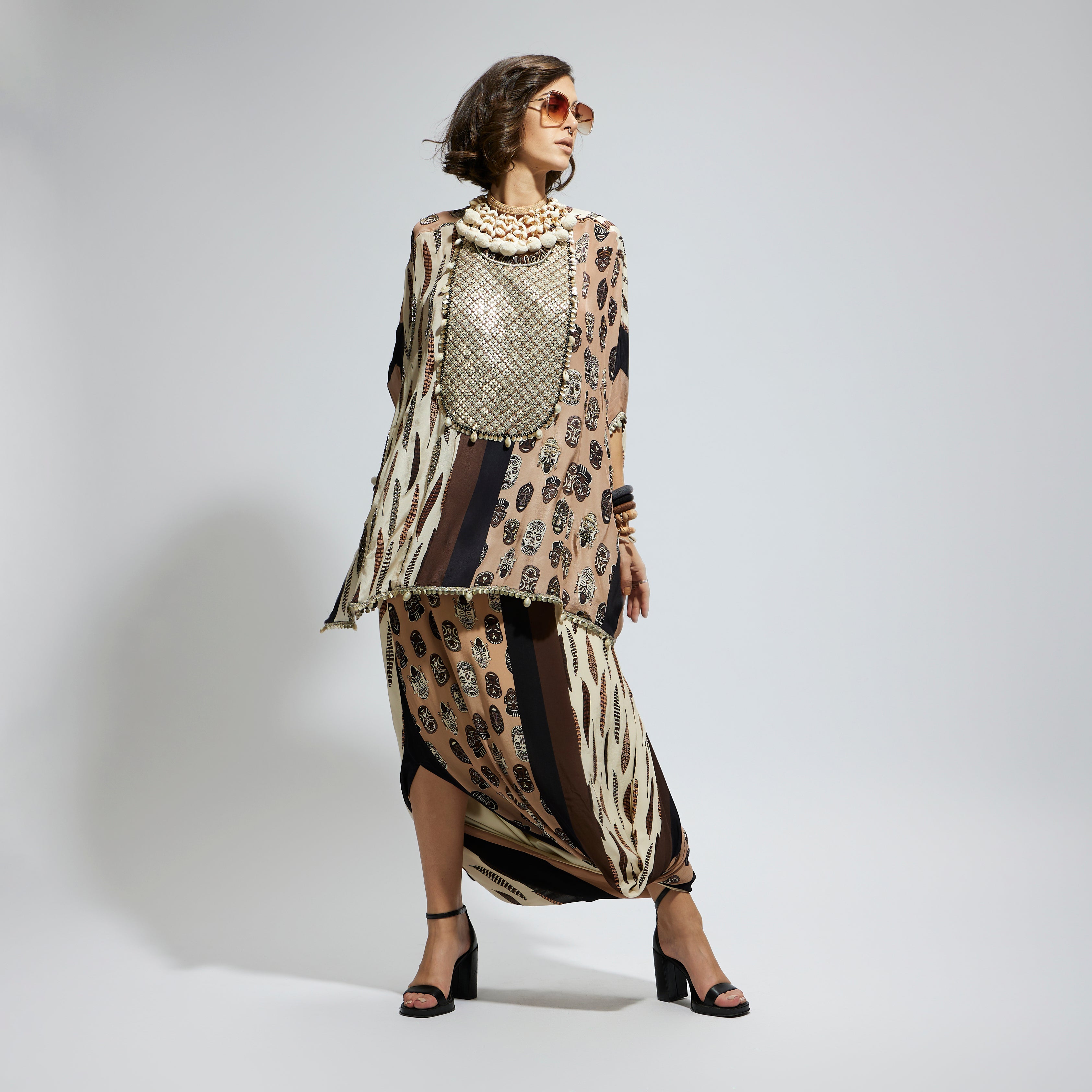 MASK AND FEATHER METALLIC EMBROIDERED YOKE SHORT KAFTAN PAIRED WTH DRAPE SKIRT