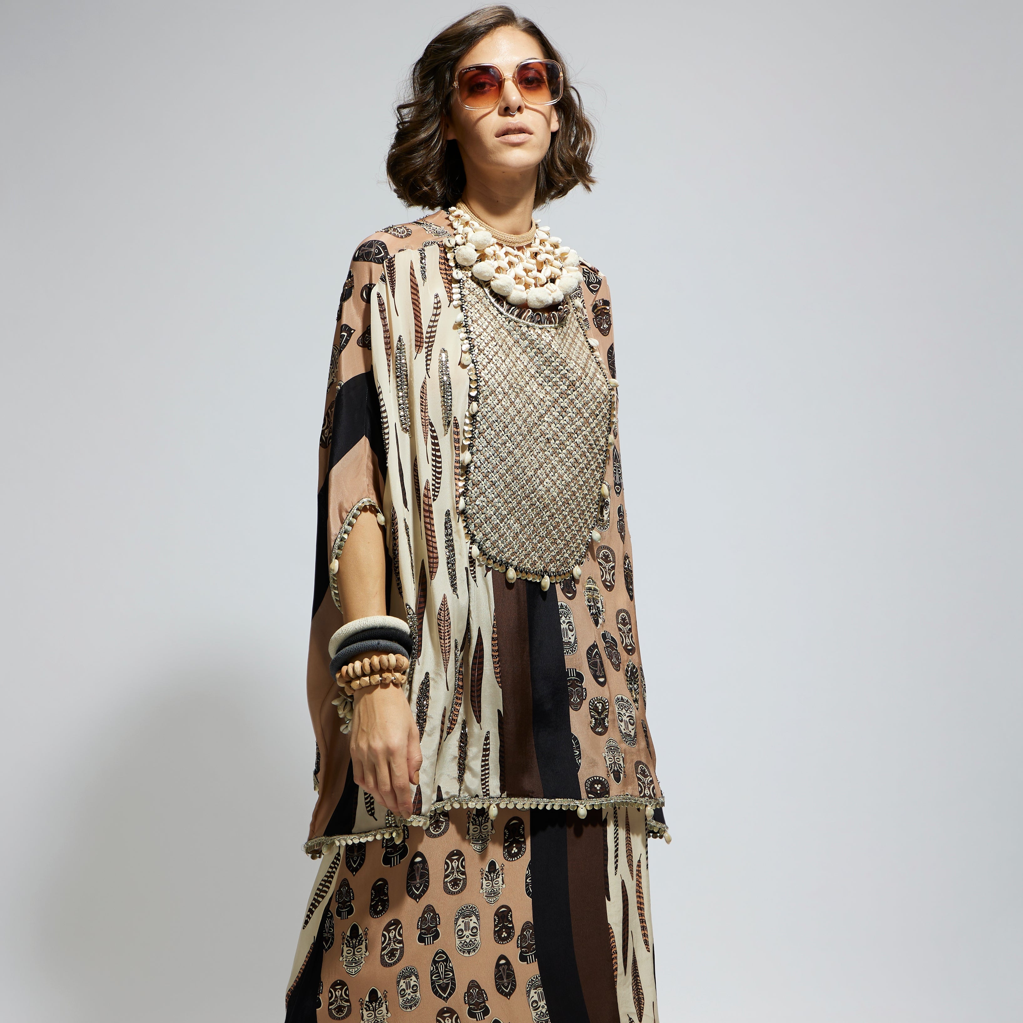 MASK AND FEATHER METALLIC EMBROIDERED YOKE SHORT KAFTAN PAIRED WTH DRAPE SKIRT