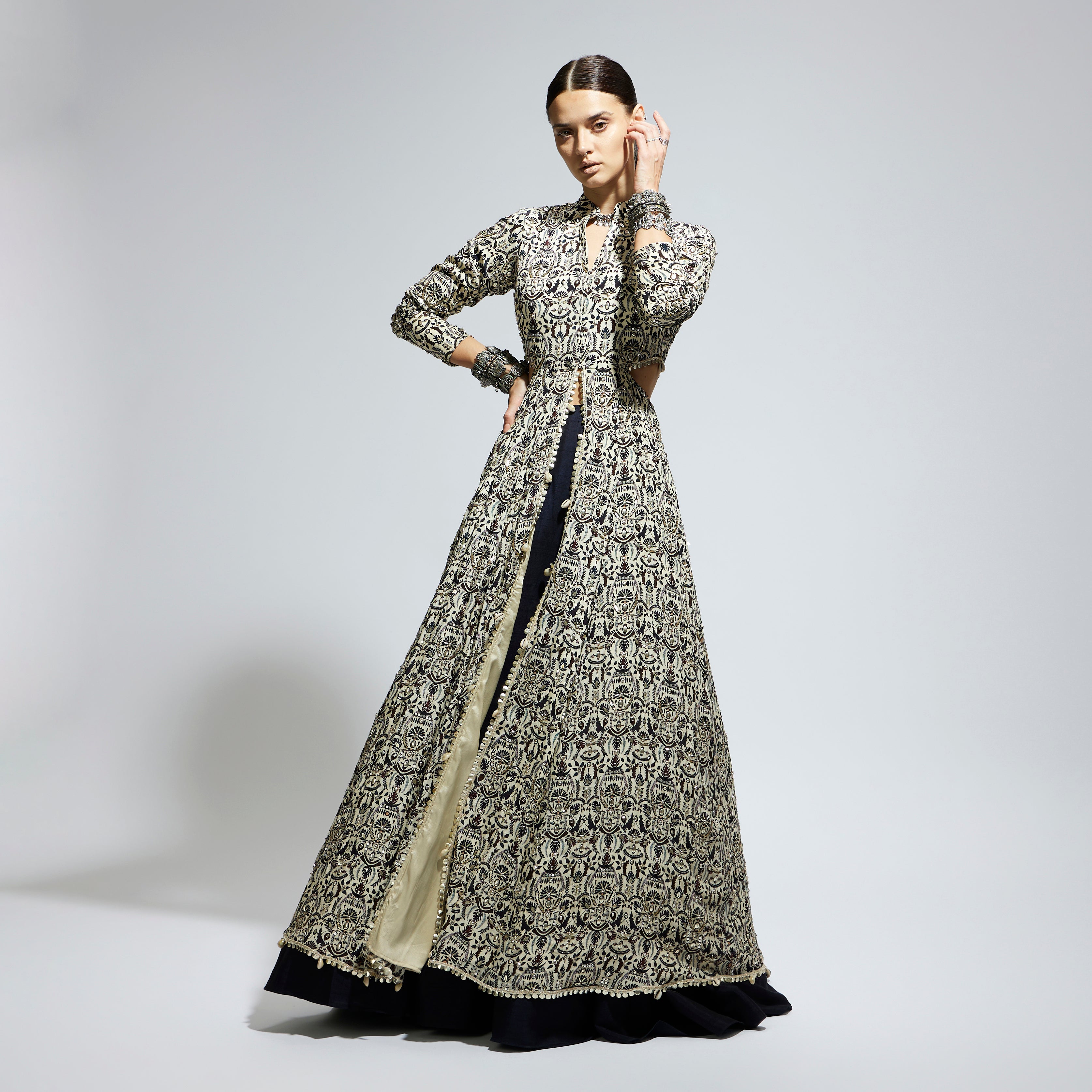 WHITE HEAVILY EMBELLISHED WAIST CUT OUT JACKET PAIRED A MIDNIGHT BLUE LEHENGA